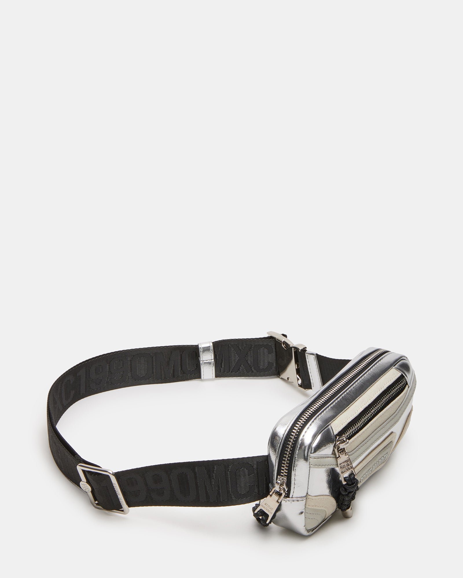 Close-up of the Madridd belt bags zipper and bungee feature.