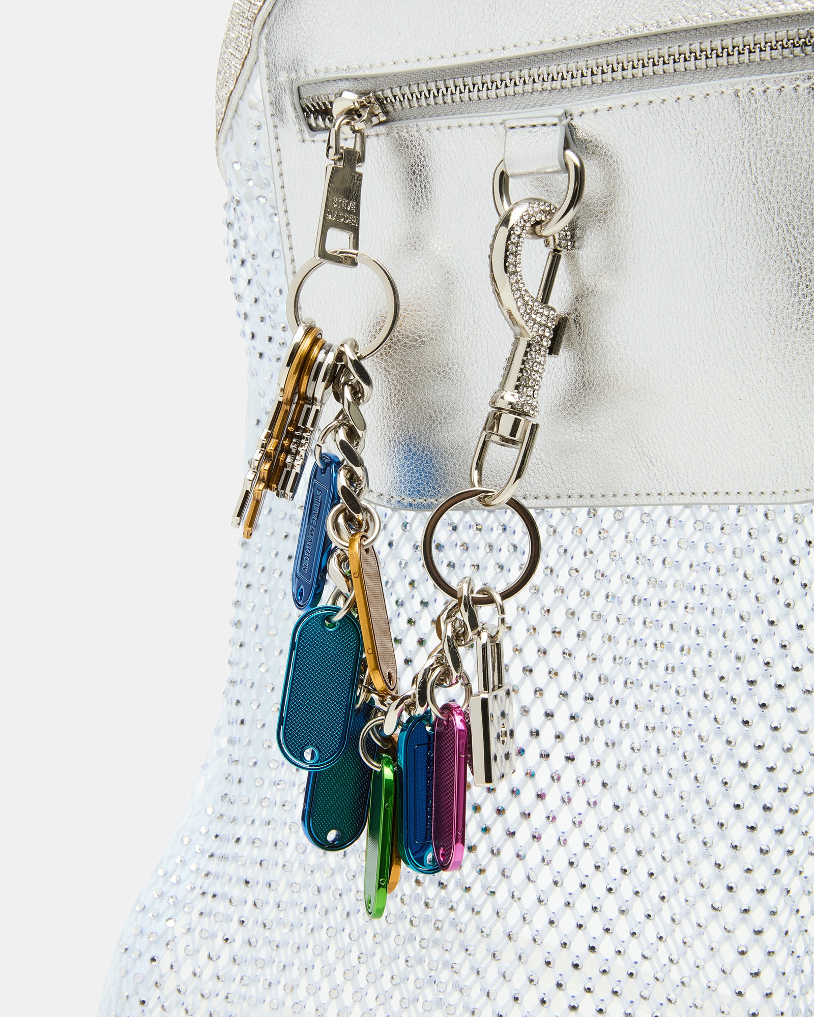 Front view of the tote bag white with charm accessories displayed