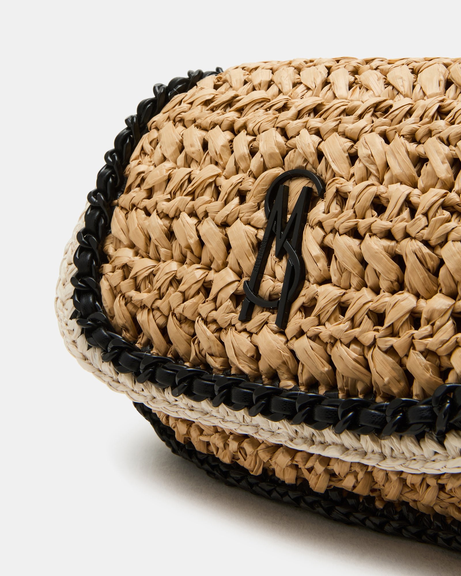 Side profile of natural straw bag showing slim silhouette and texture