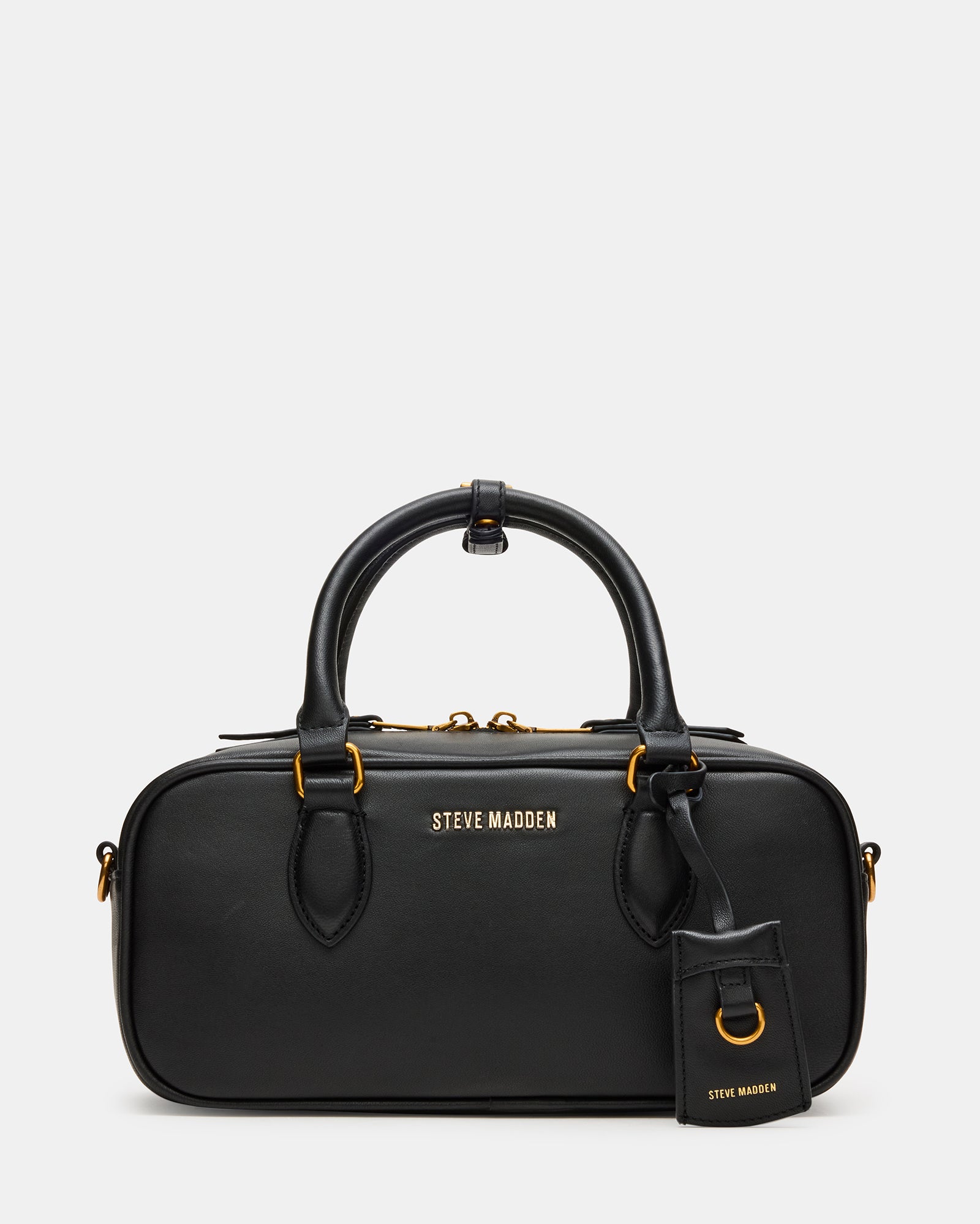 Elegant black leather crossbody bag displayed on a table.