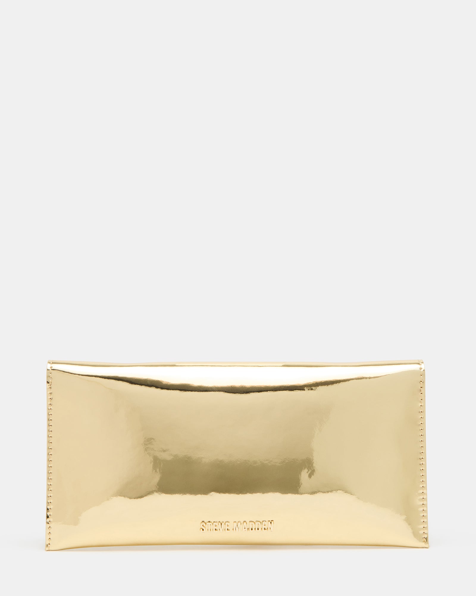 Side profile of clutch worn with crossbody strap in a city evening setting