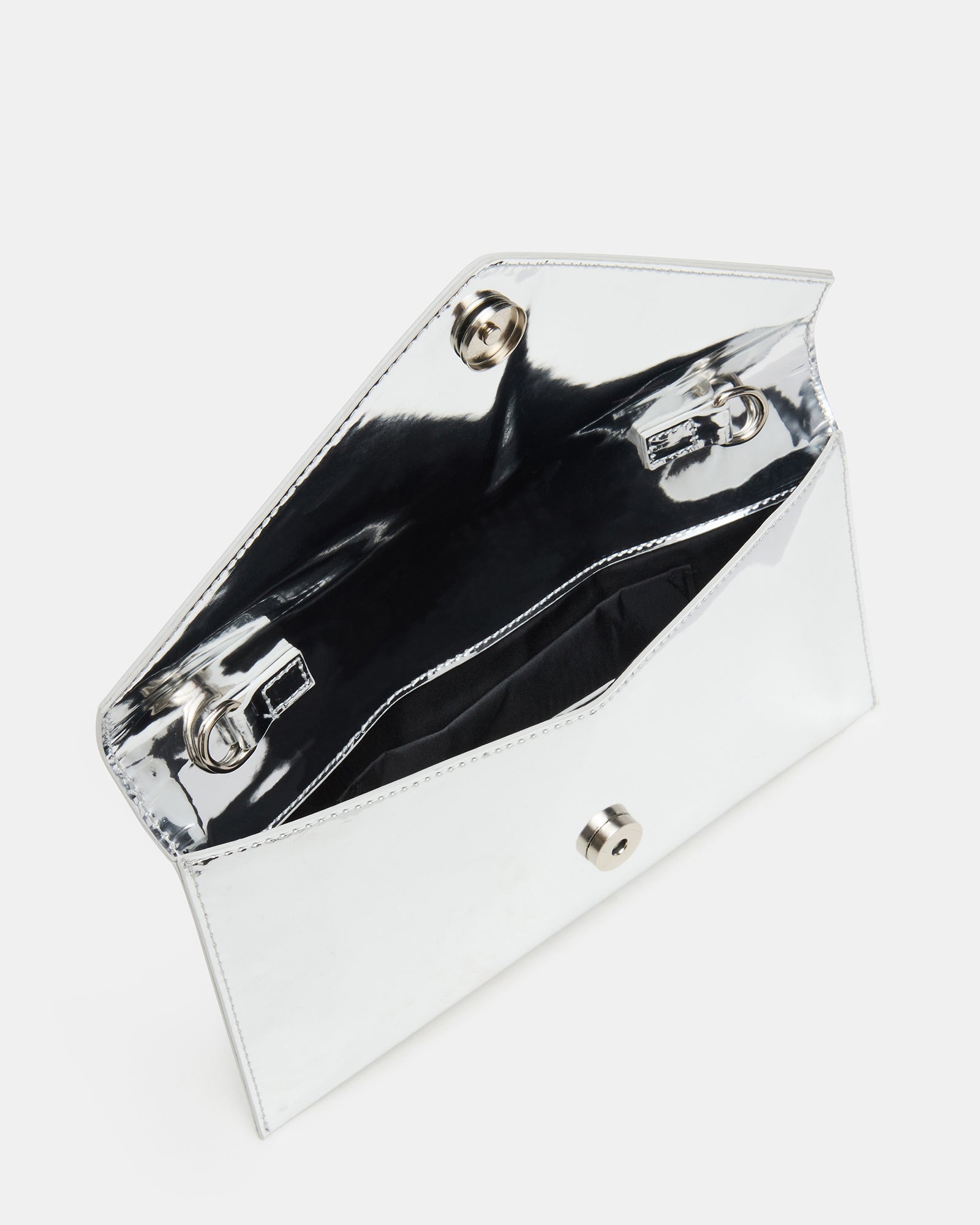 Close-up of silver patent evening bag with chain tassel detail