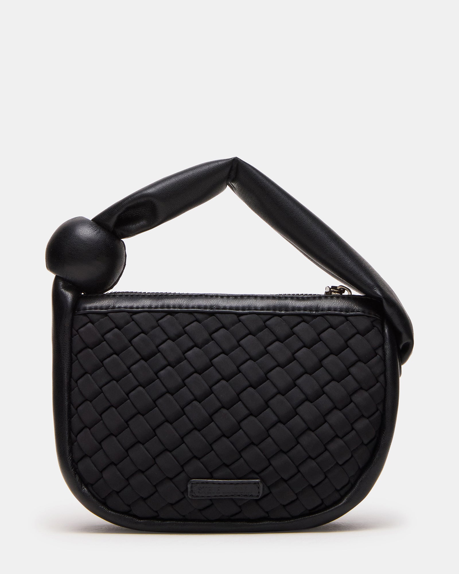 Side profile highlighting mini tote bag size and soft structure