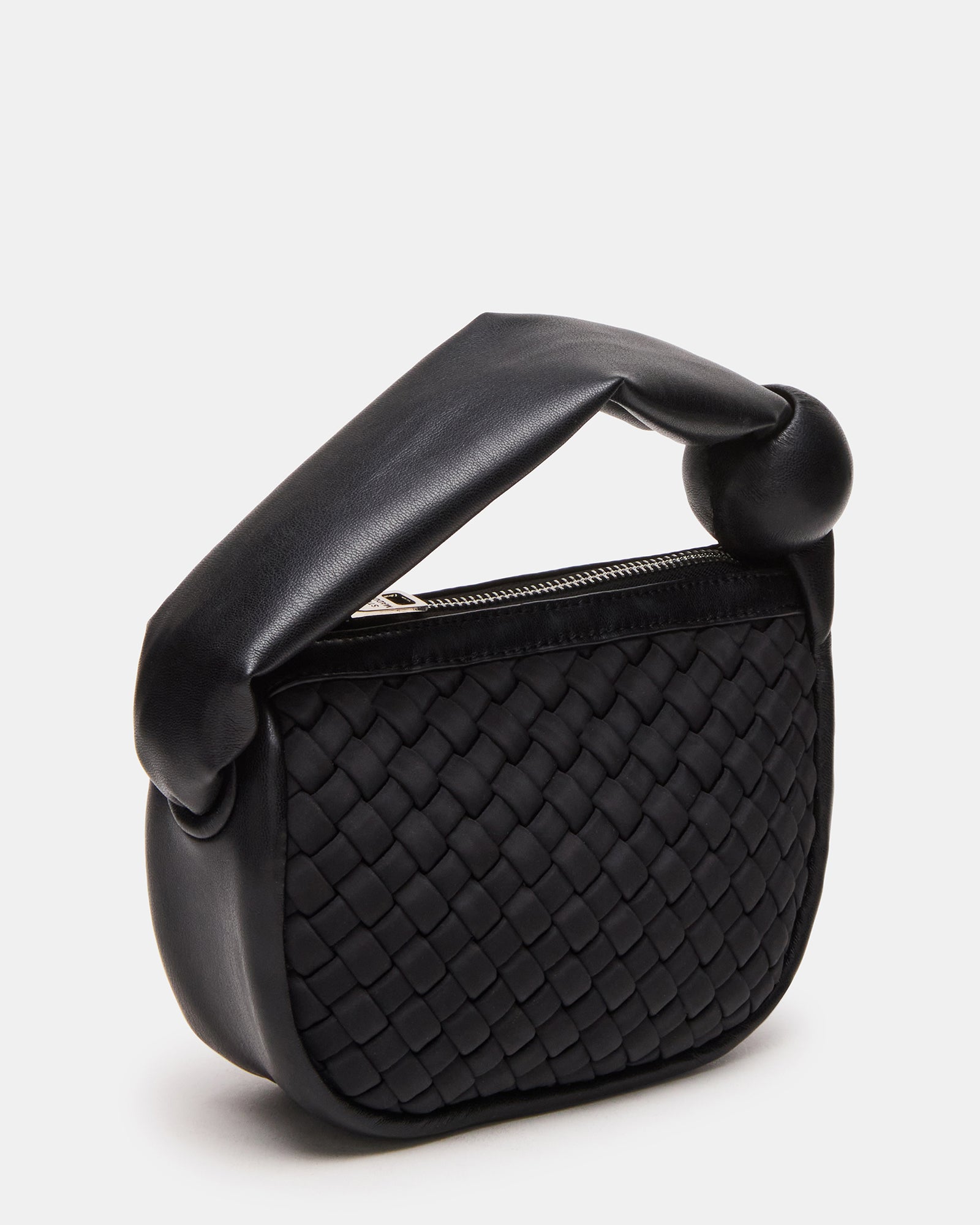 Front view of puffed handle bag on Texas street style model
