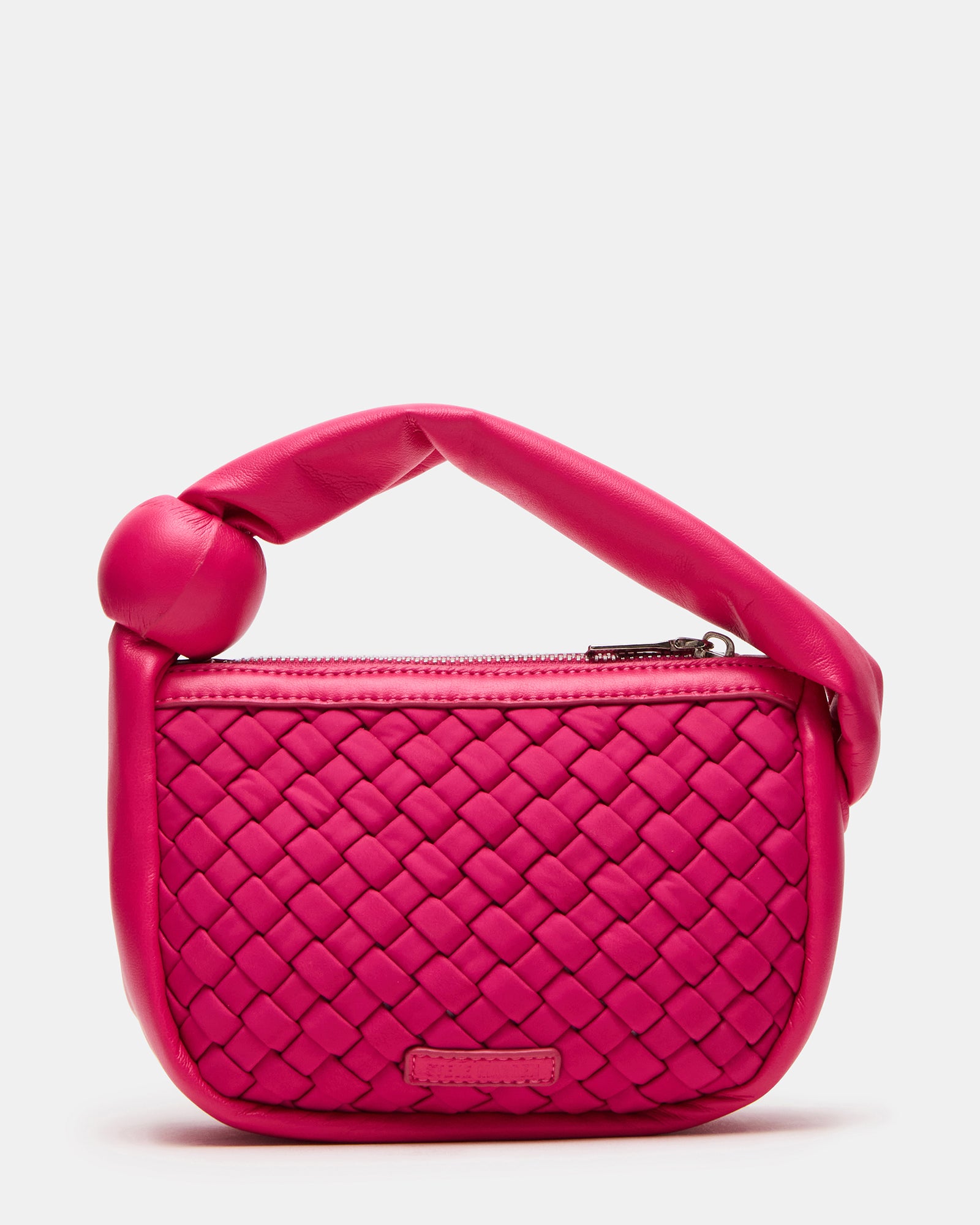 Close-up of the puffed handle on the fuchsia neoprene mini bag.