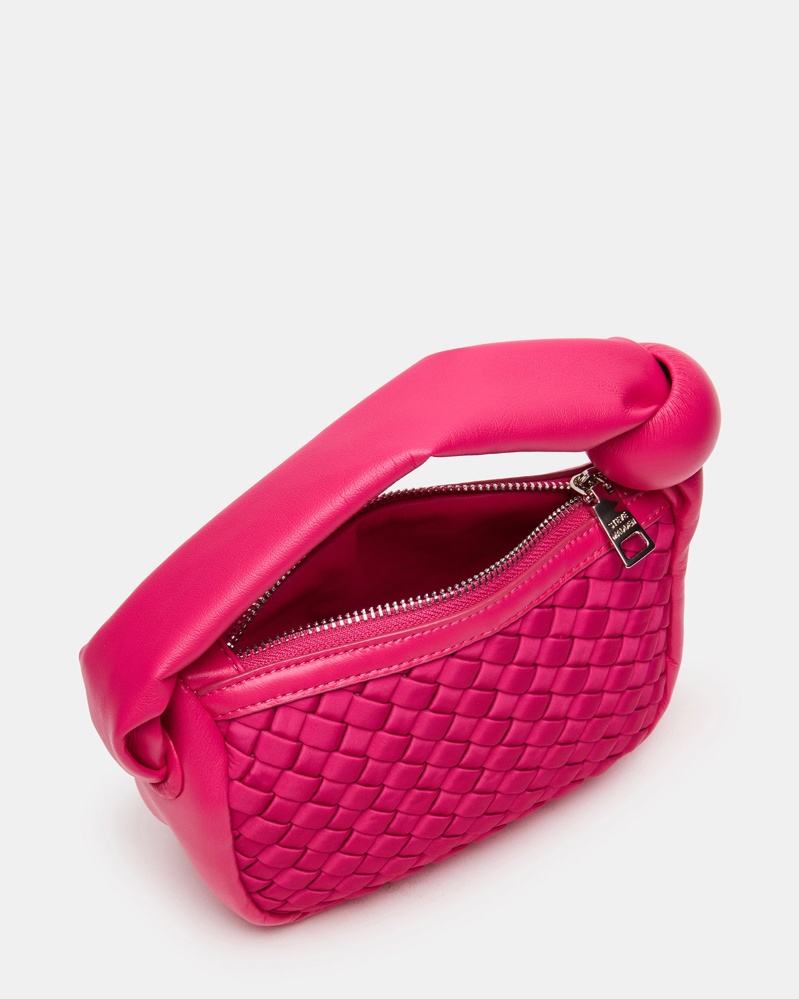 Side angle of stylish neoprene mini bag featuring zipper closure.