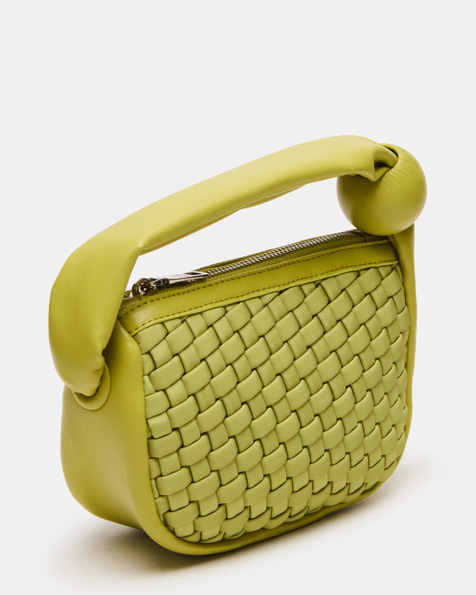 Woven leather mini bag with puffed handle on a stylish background.