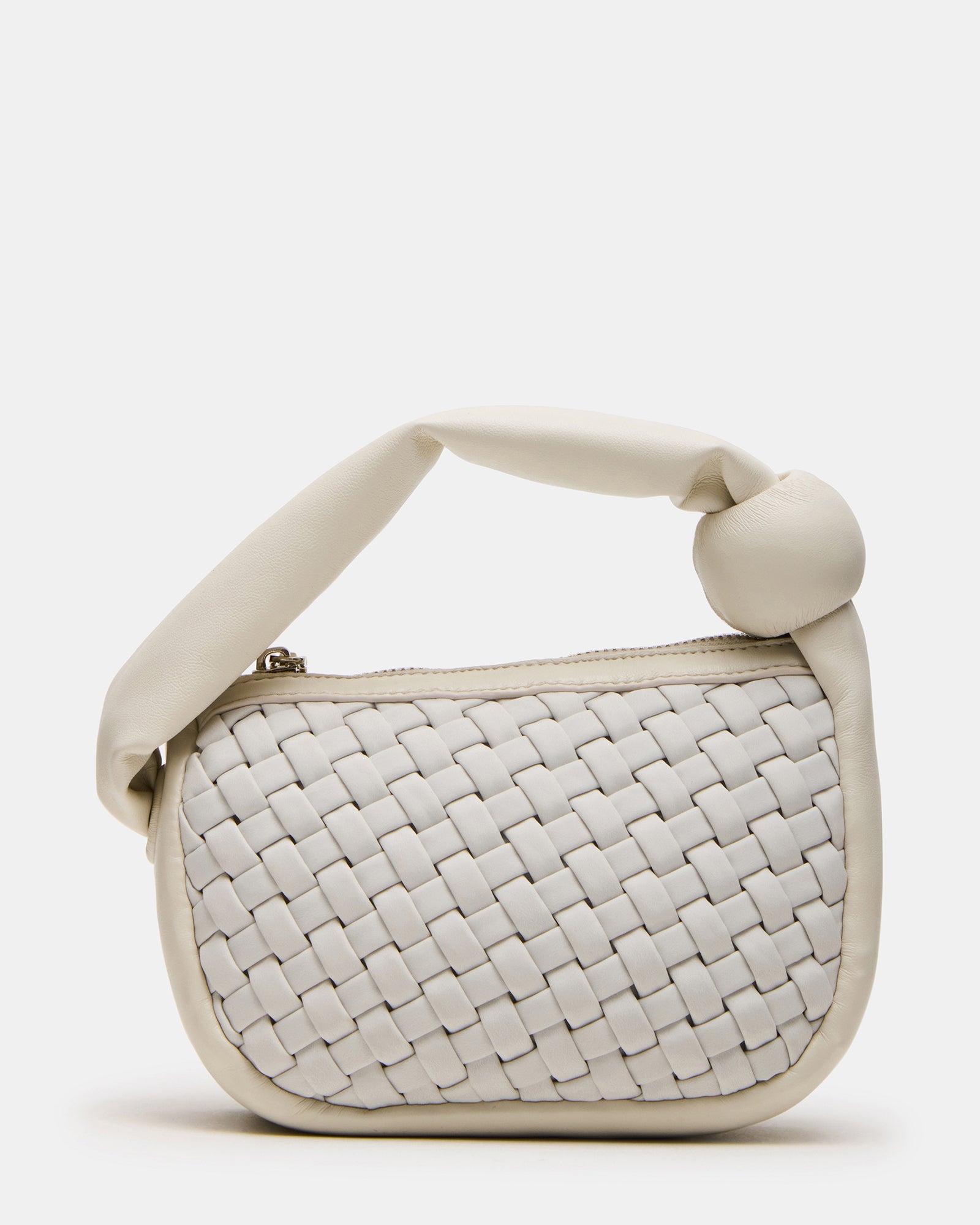 Chic white mini woven bag showcased on a table.