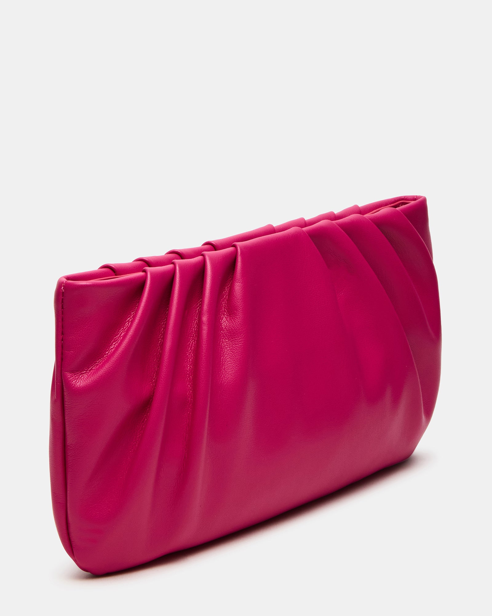 NIKA fuchsia leather crossbody bag with chain strap on a stylish evening table