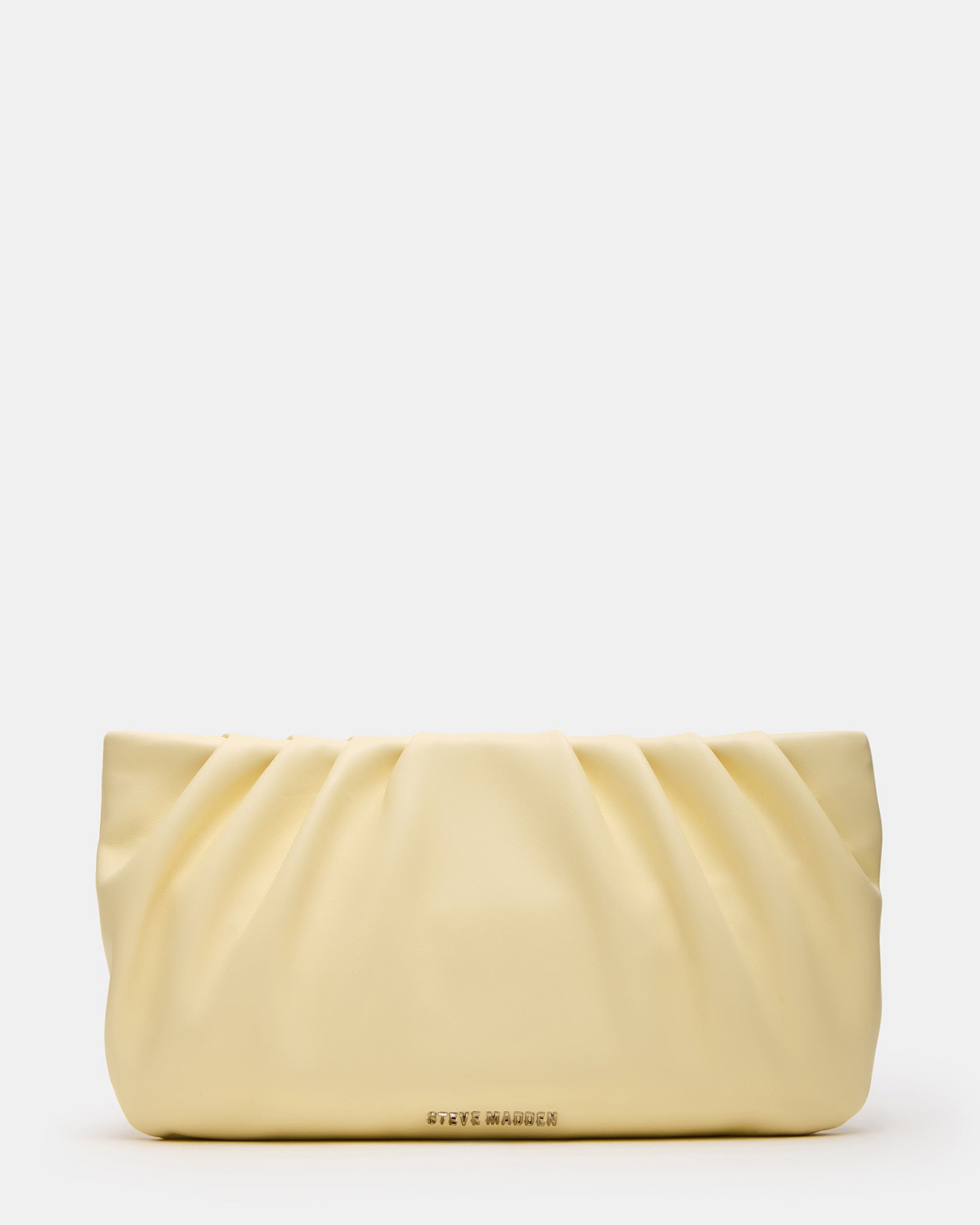 Clutch styled as black crossbody bag worn over shoulder outdoors