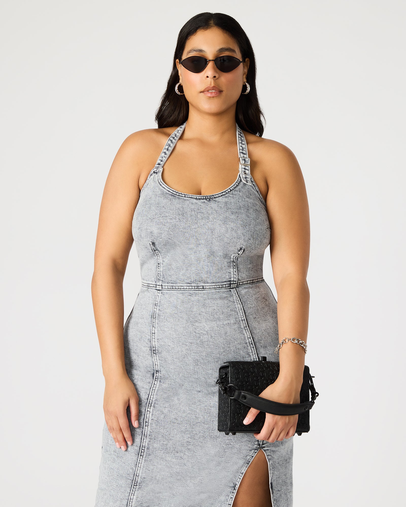 Front view of Noya Luxe crossbody bag showcasing embossed details