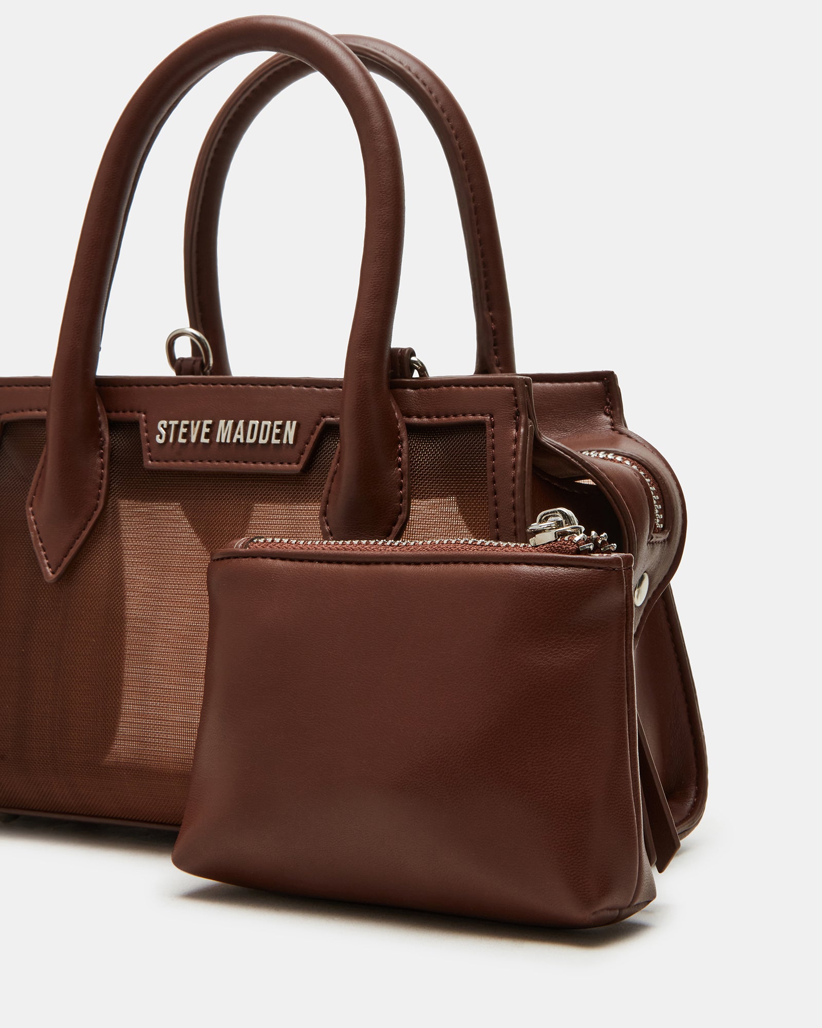 Close-up of the Peachy top-handle bags top zipper closure and interior pouch.