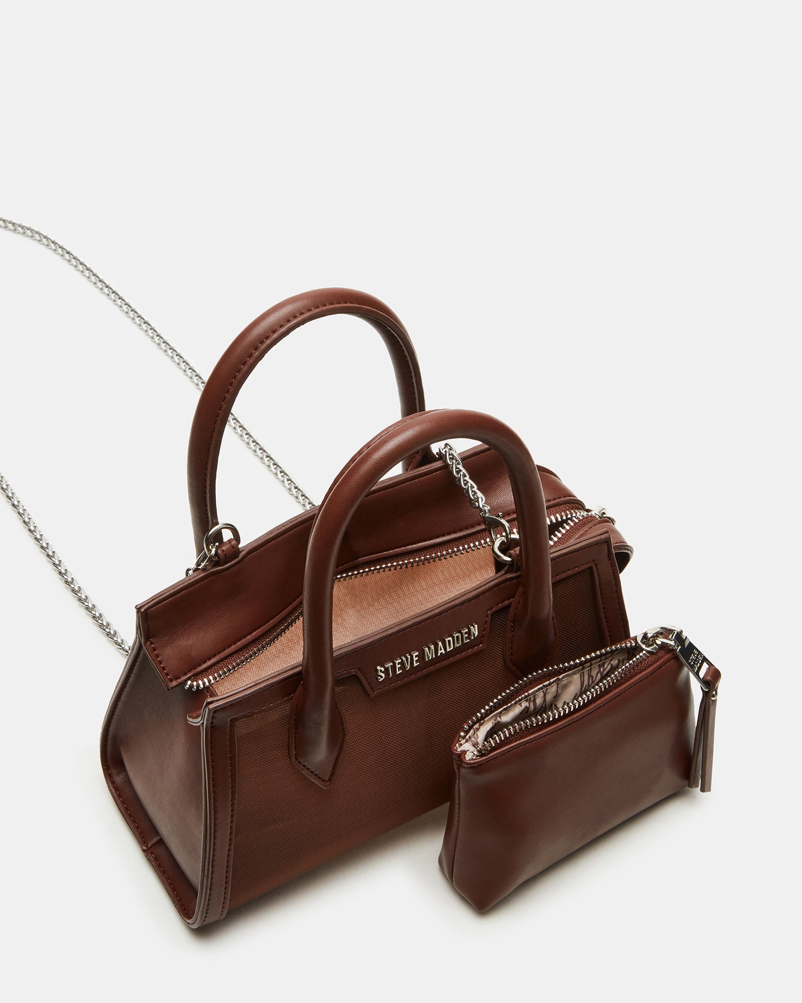 Side angle of the Peachy mini handbag with detachable crossbody strap.