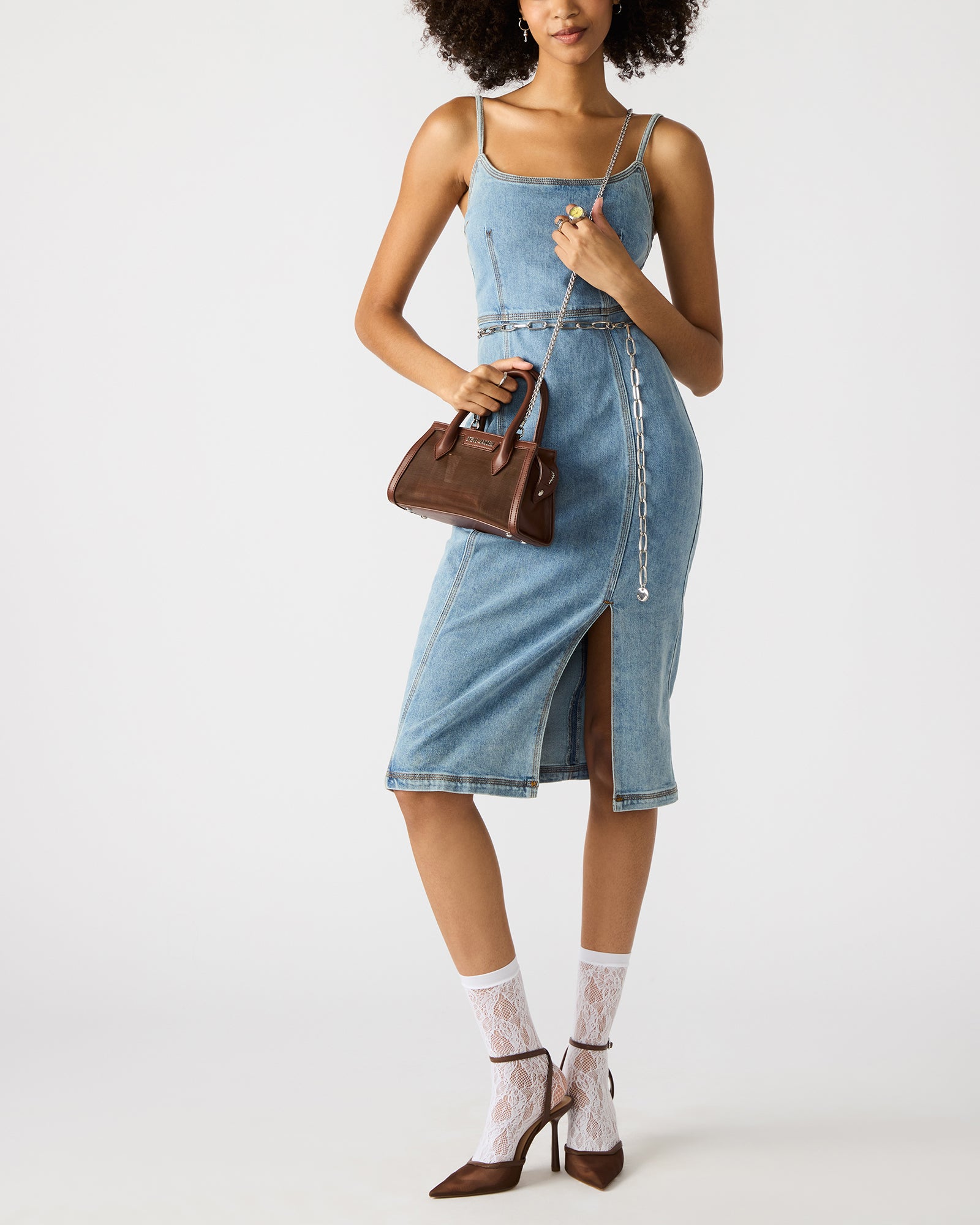 Side angle of the Peachy mini handbag with detachable crossbody strap.