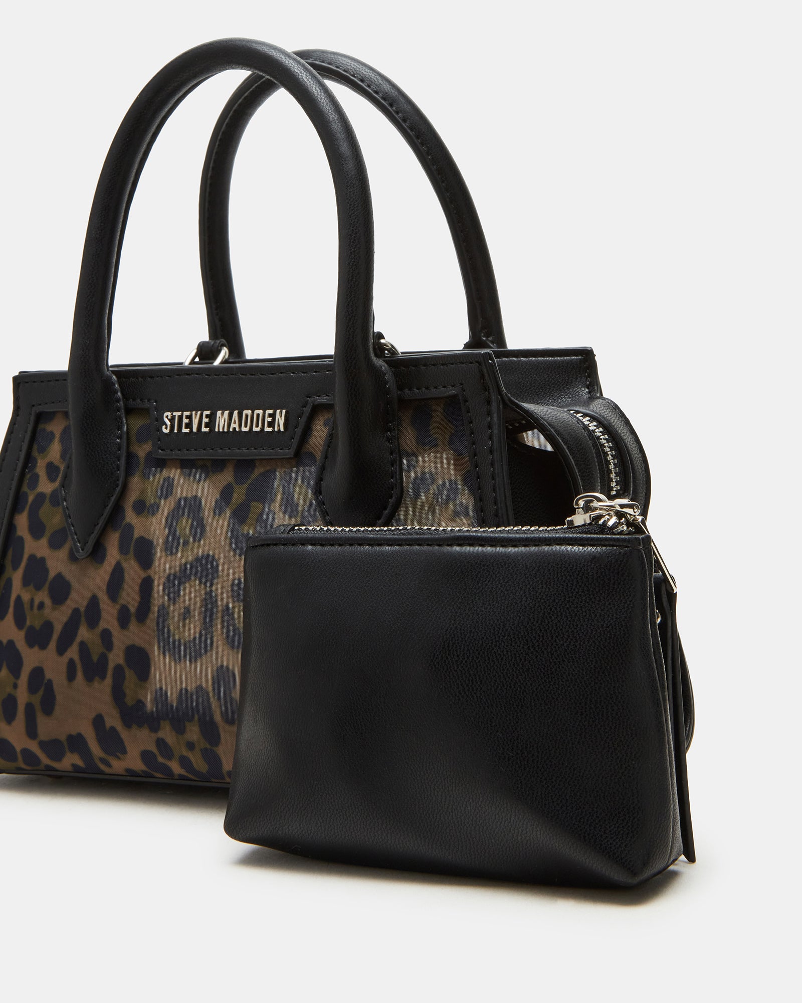 Close-up of top zipper and textured mesh on coach mini handbag-inspired purse