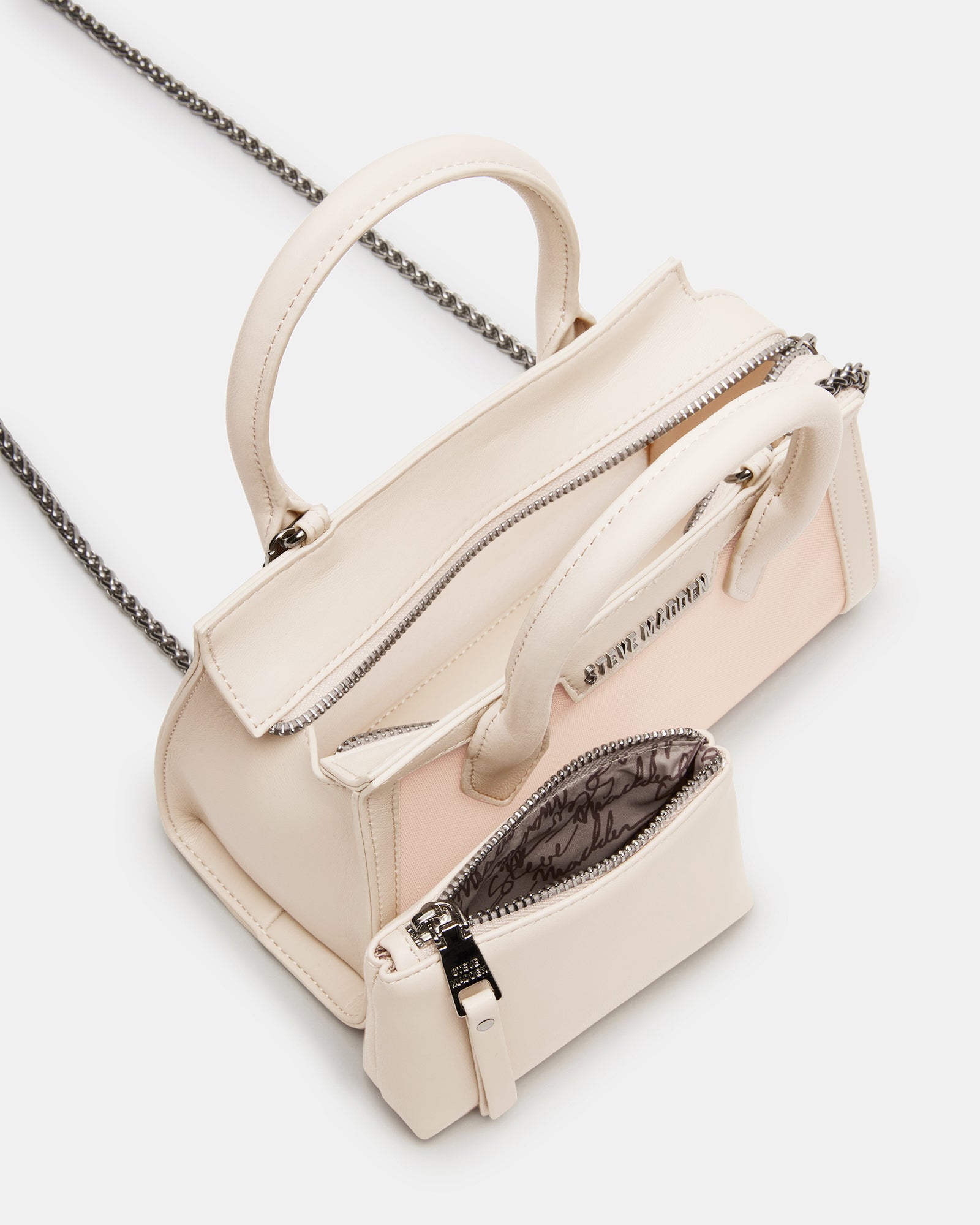 Side angle showing the detachable crossbody chain strap on the Peachy bag