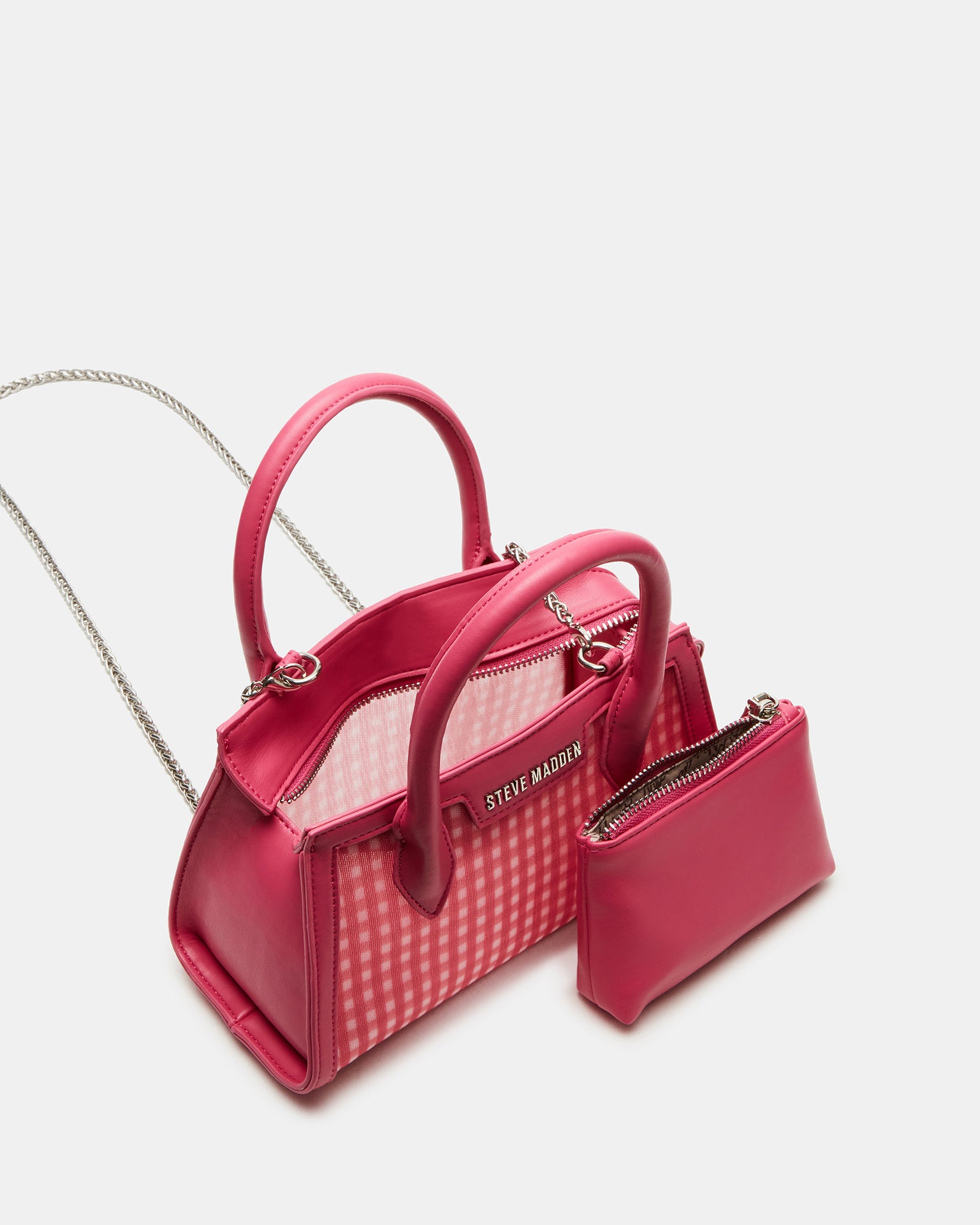 Close-up of top handle and zipper closure on mini purse handbag