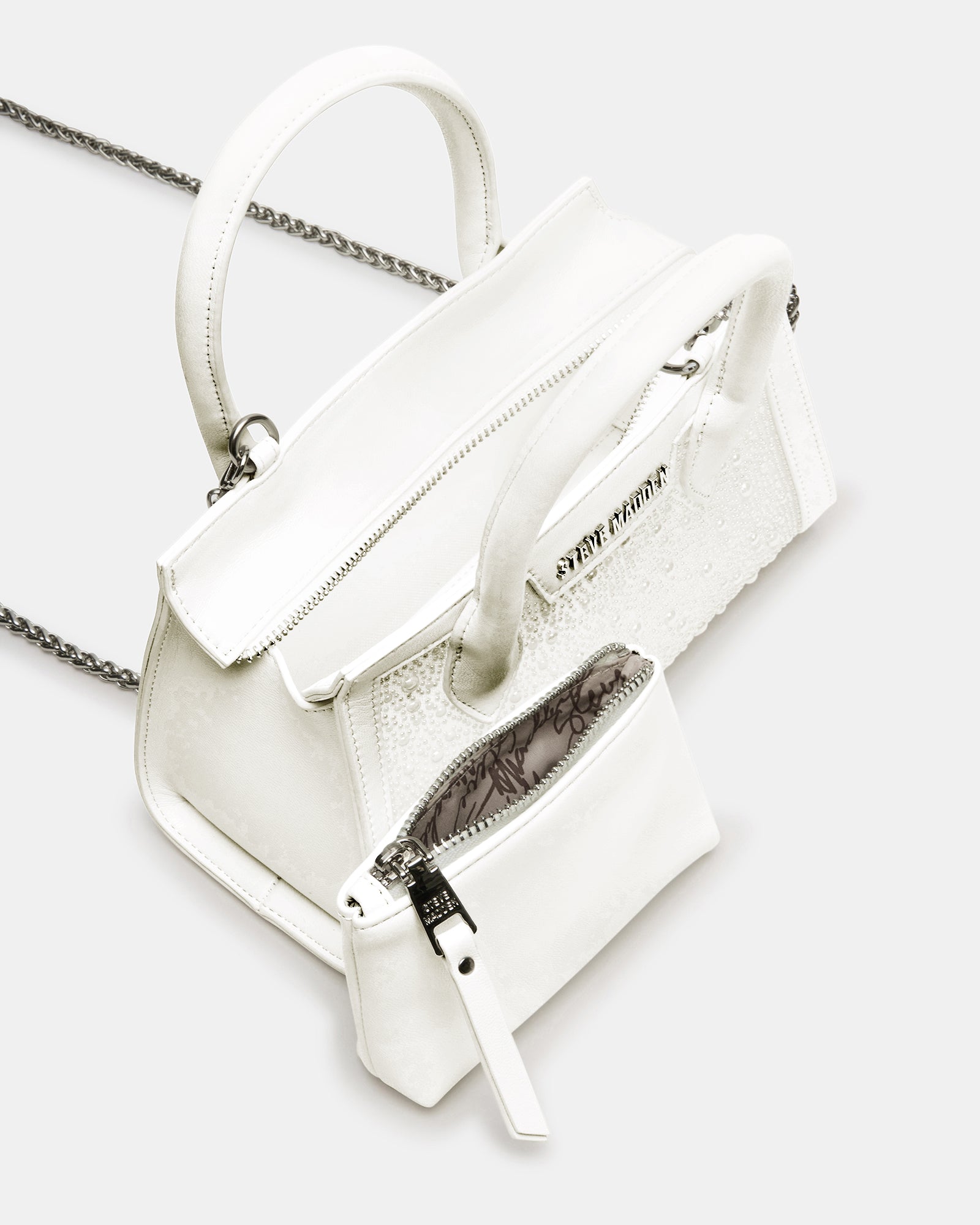 Side angle showing adjustable strap and compact silhouette of crossbody bag