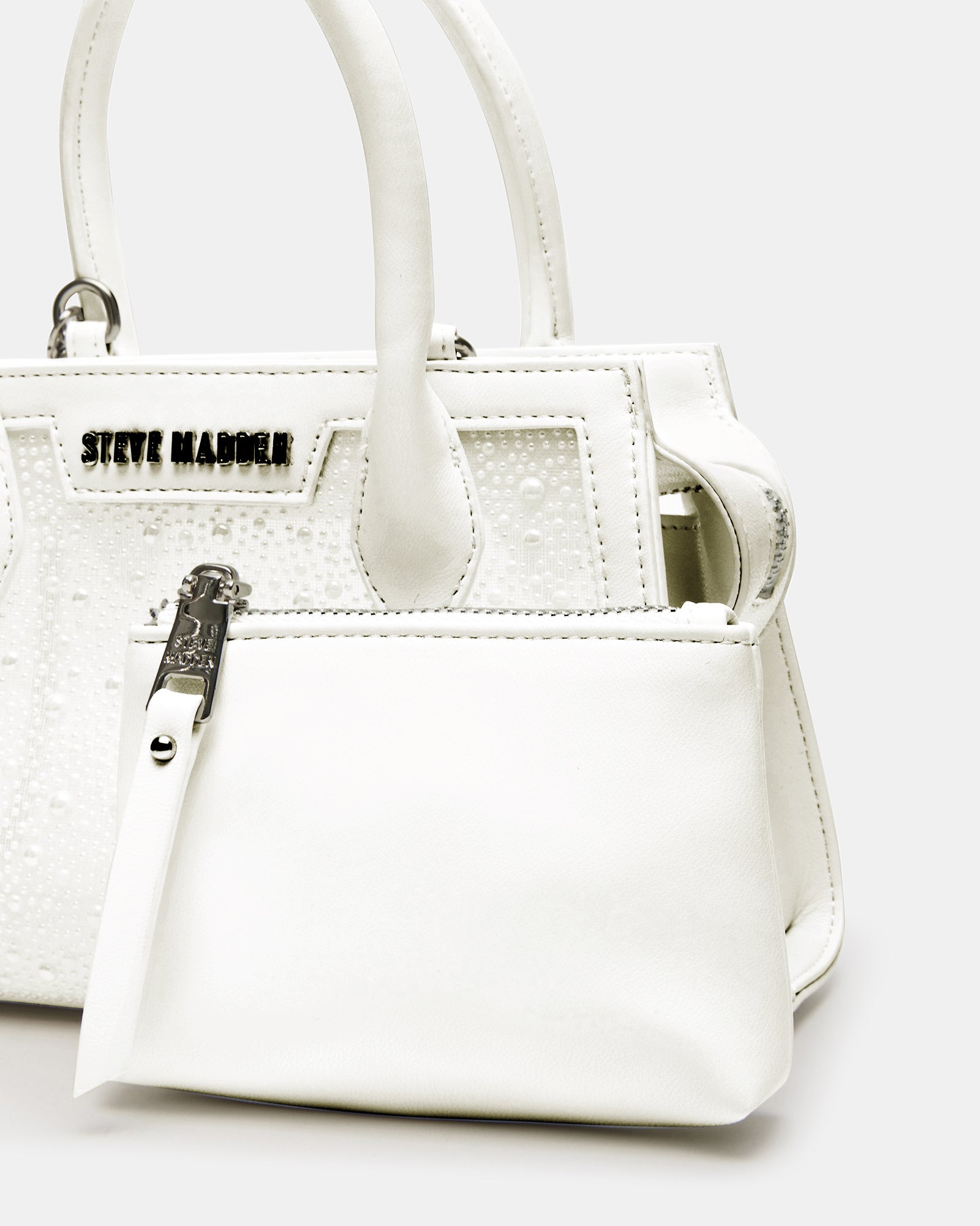 Close-up of zipper and chain strap on top handle bag