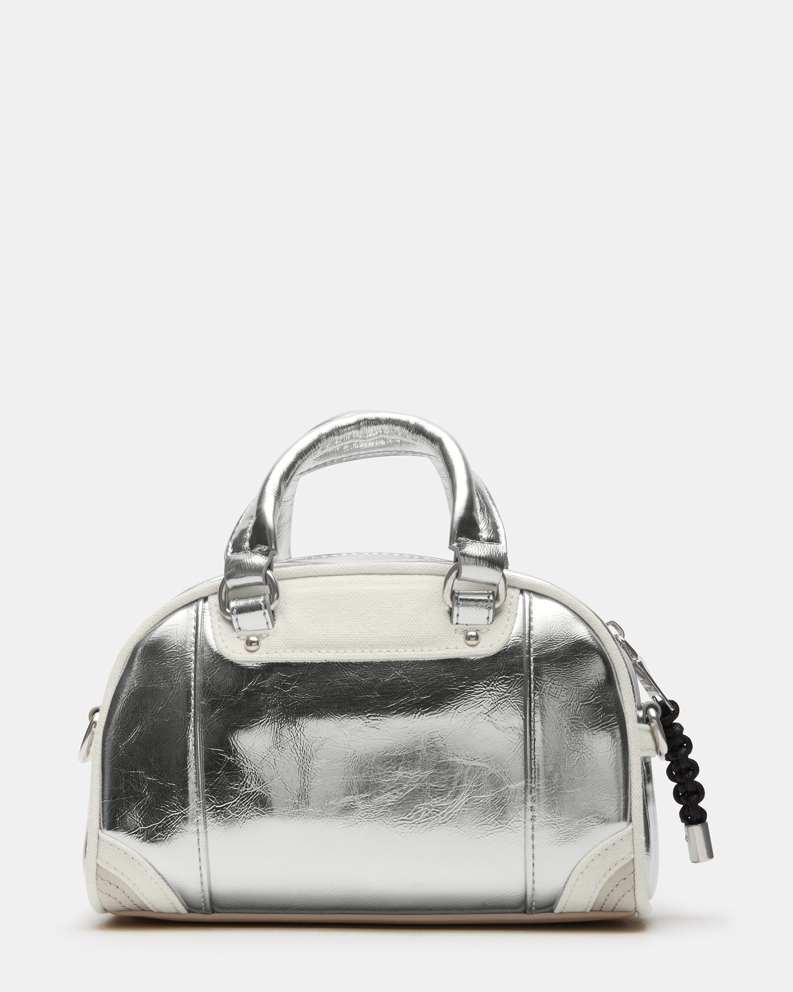 View of the dome crossbody bag laid flat with detachable straps visible