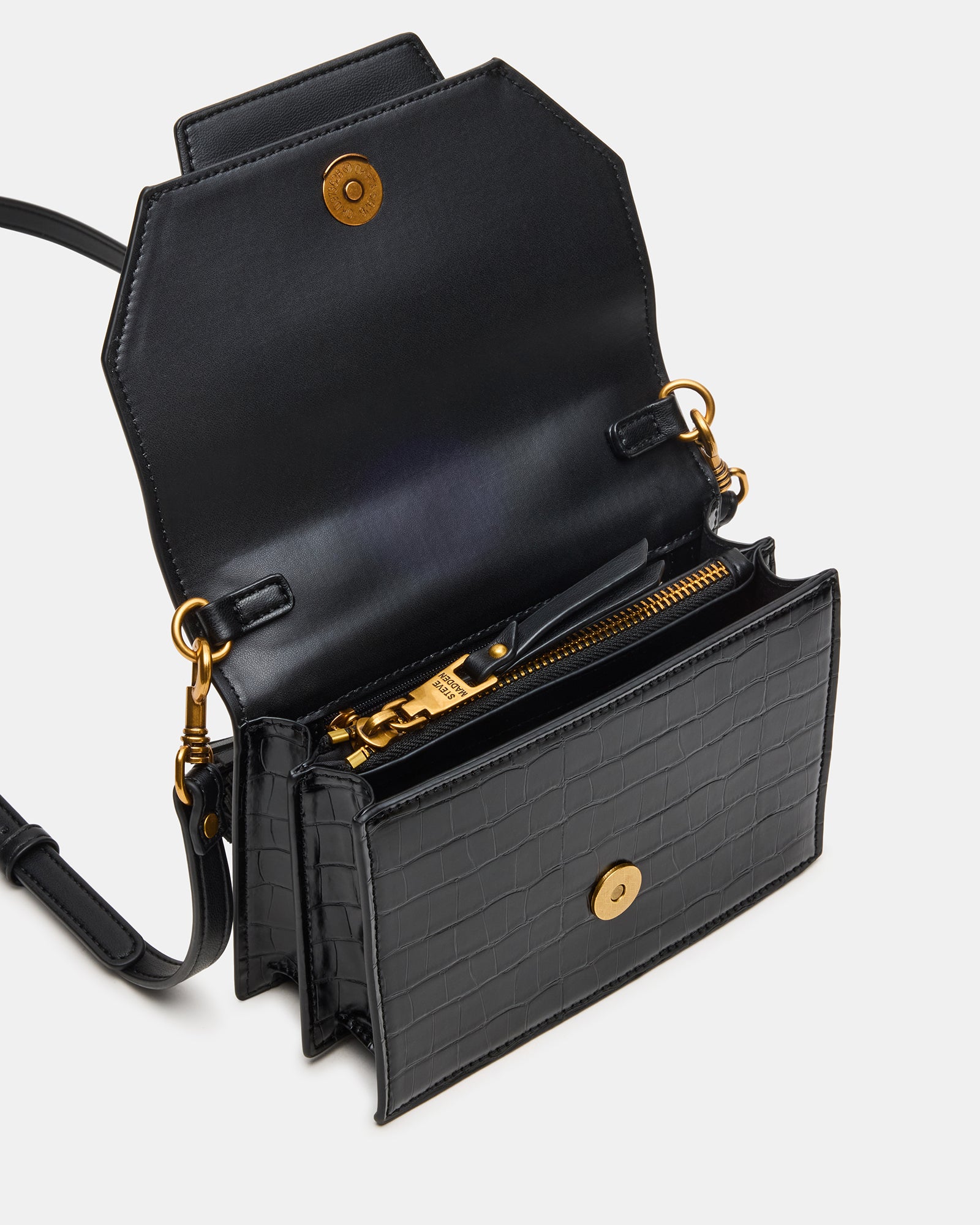Close-up of the chic black handbag showcasing its accordion gusset.