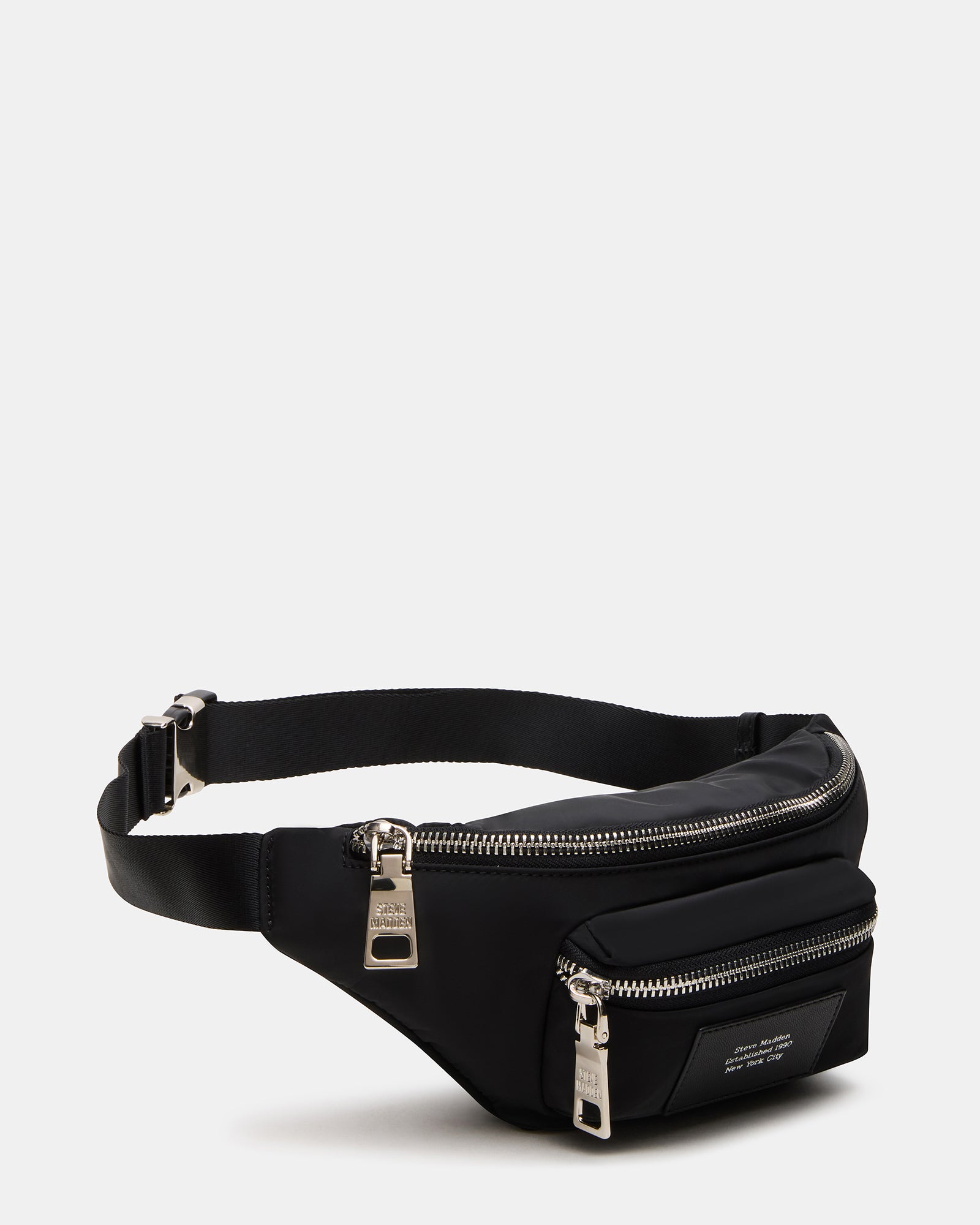 Black nylon crossbody bag with adjustable strap and oversized zipper pullers for active use