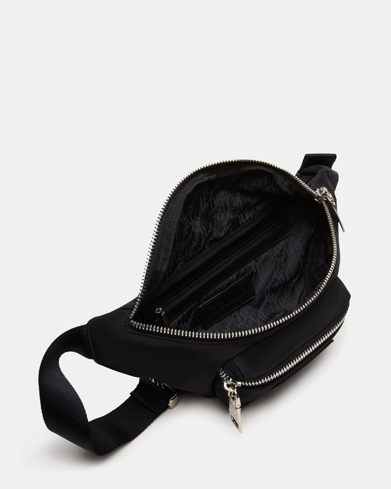 Stylish black crossbody bag worn as a sling during outdoor adventures