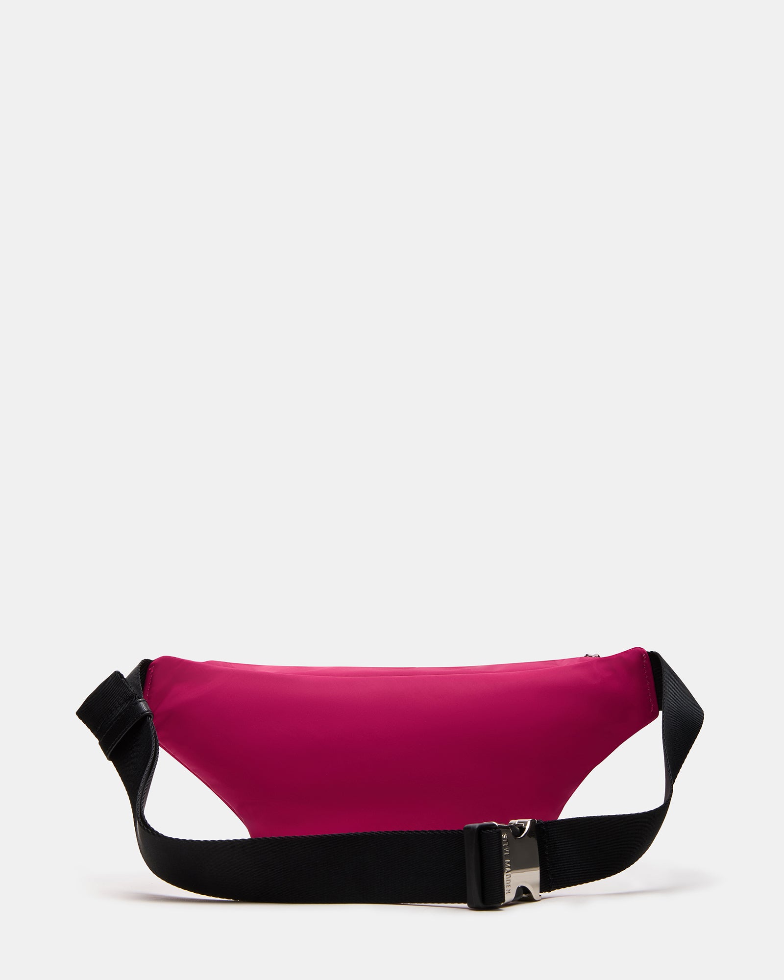 Crossbody bag worn over shoulder during a Miami beach walk at sunset