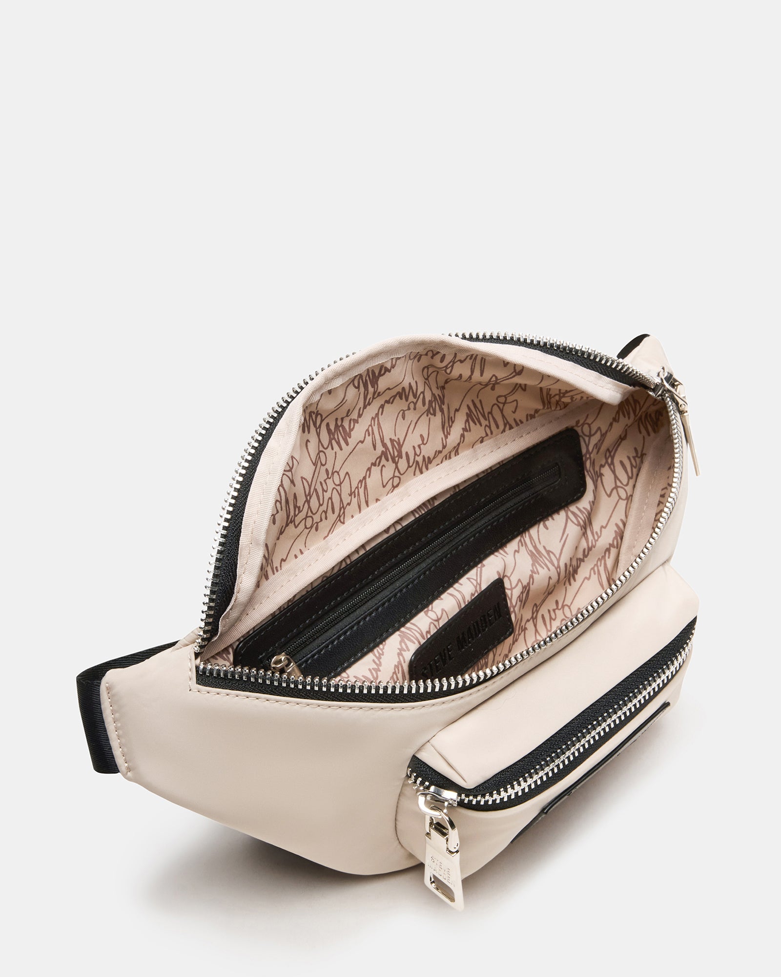 Close-up of zipper and embossed patch on lululemon crossbody bag
