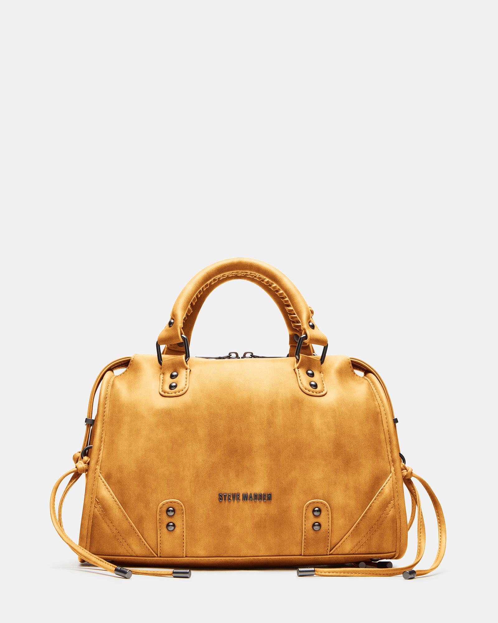Styled with a casual outfit, showcasing the versatile top handle and crossbody strap