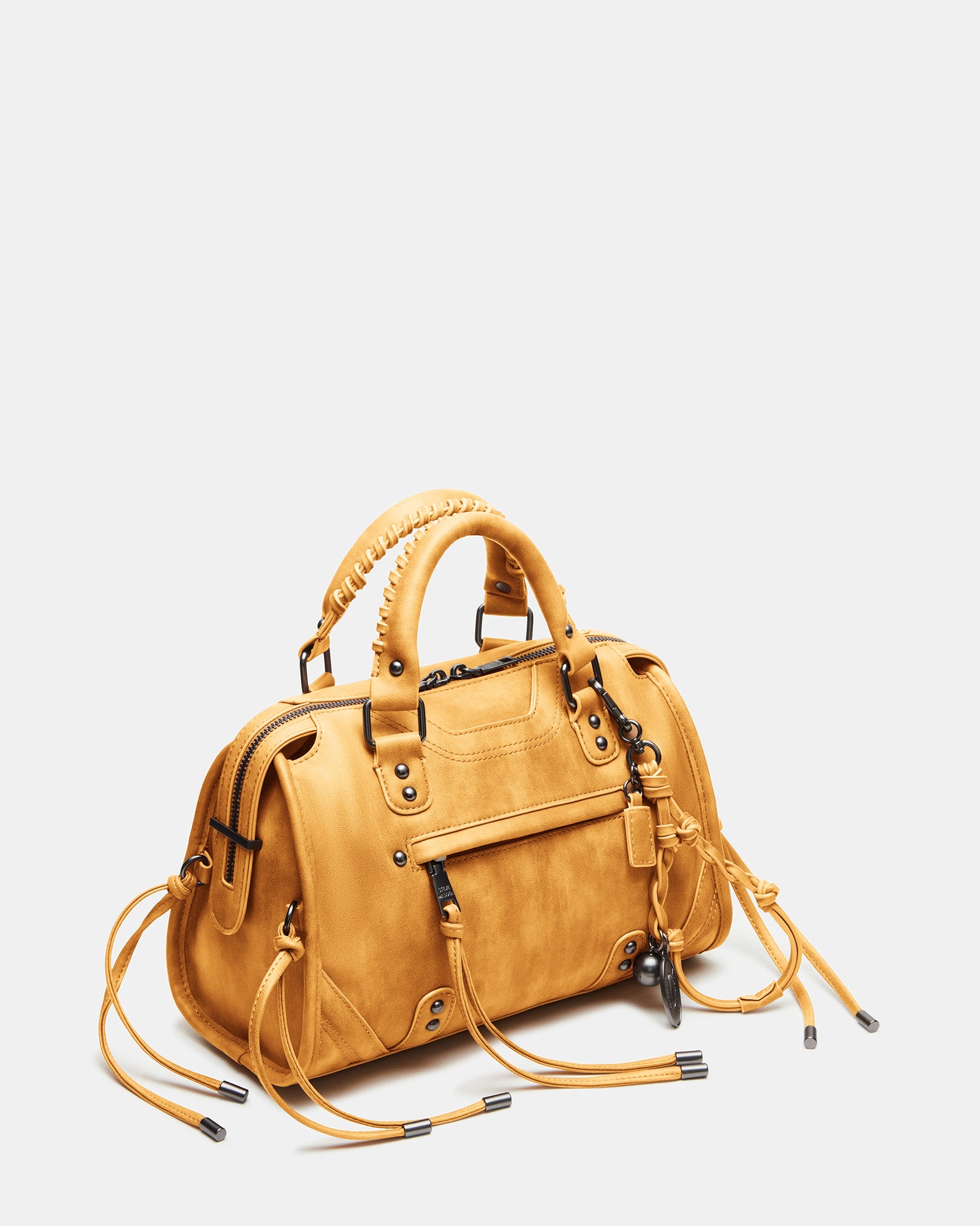 Side view of the RIGGS Banana leather crossbody bag with fringe accents