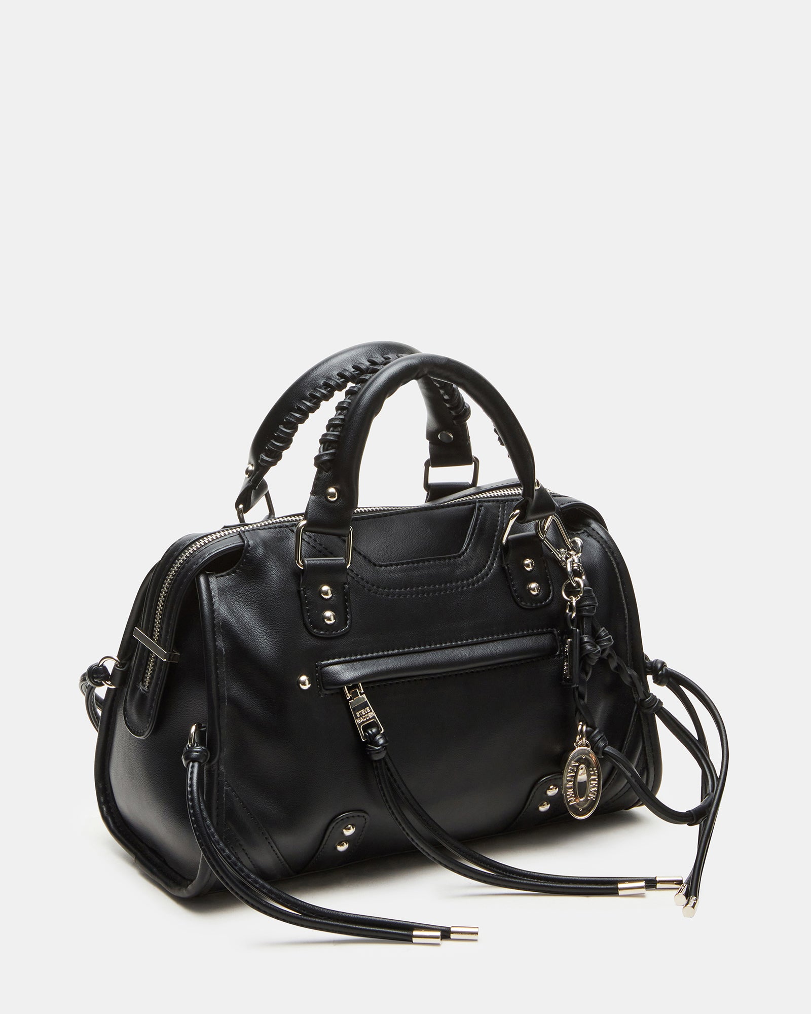Front view of distressed handbag with braided fringe and dome studs