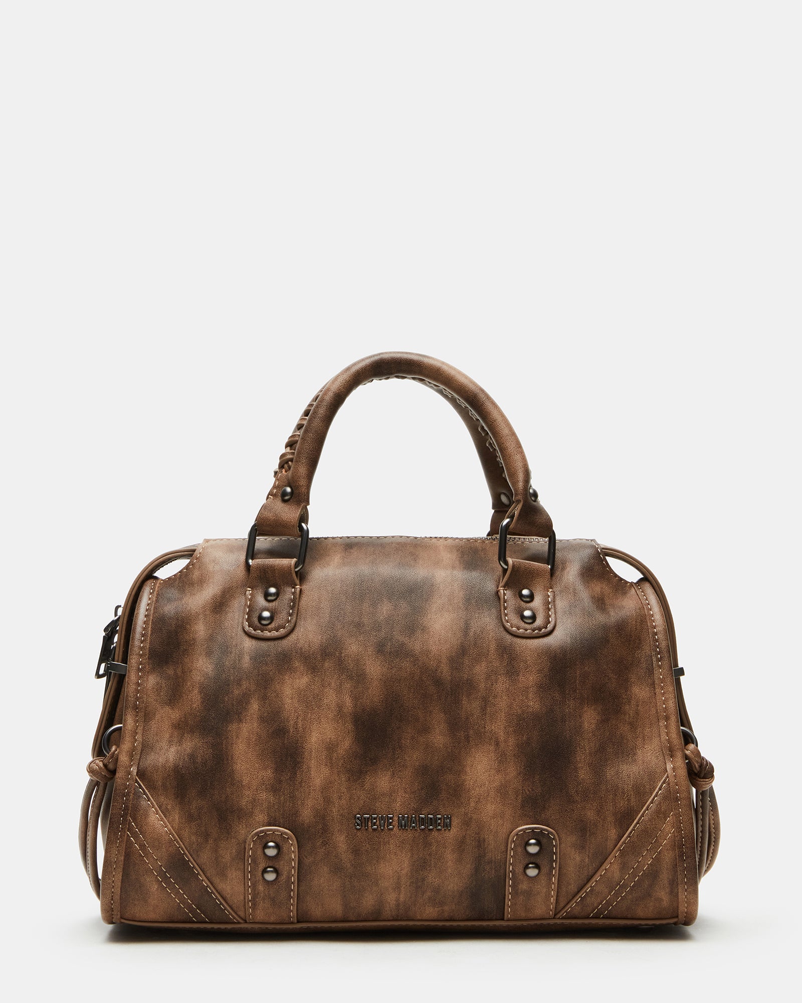 Close-up of distressed brown leather handbags showing texture and stud details