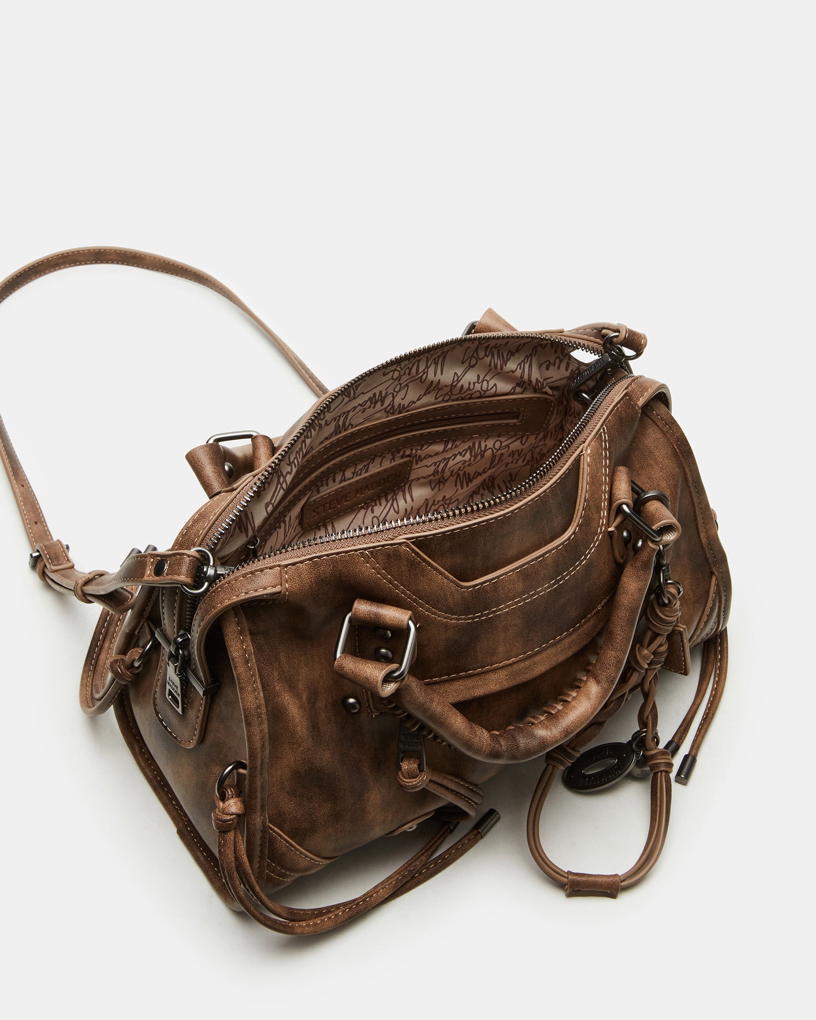 Slouchy satchel bag worn crossbody in an urban setting