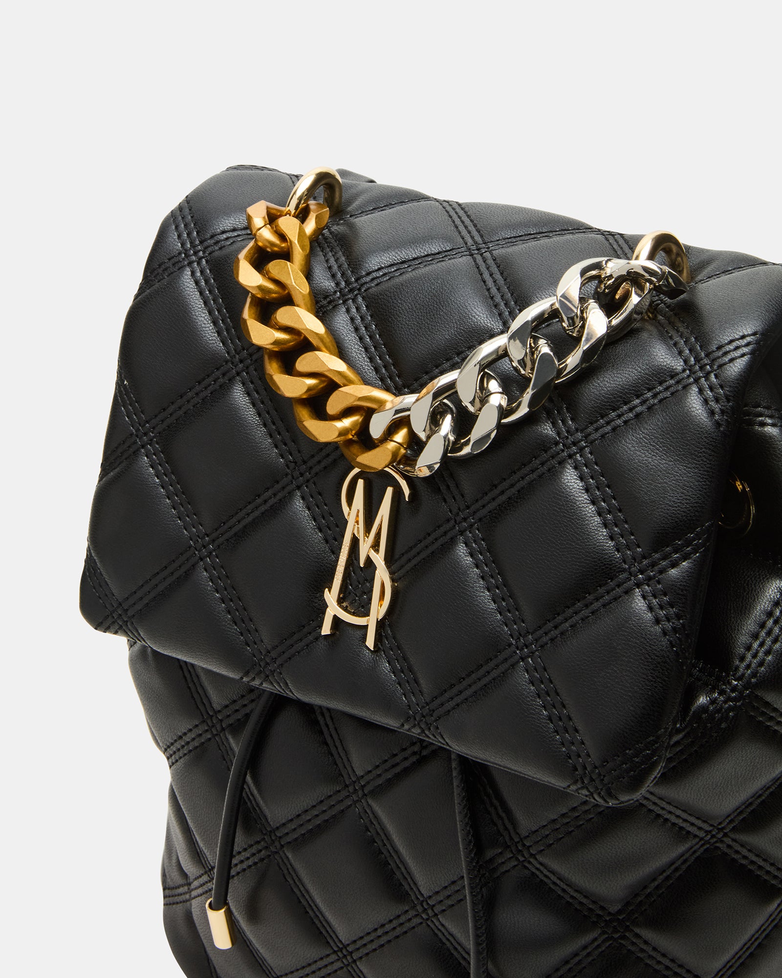 Side angle highlighting quilted texture and adjustable chain straps on the Royce bag