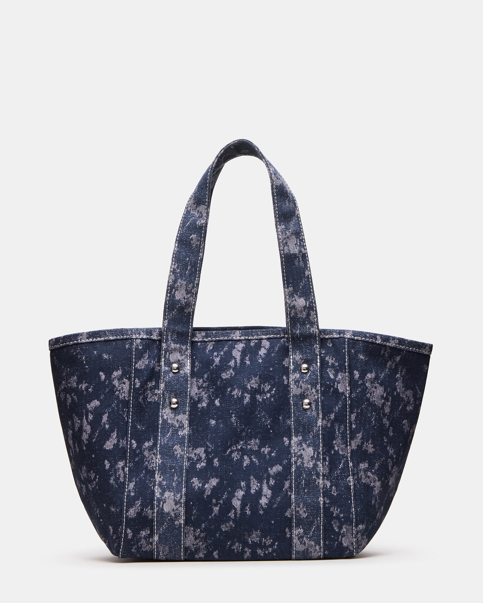 Side angle of the denim fabric tote with rivet details and stylish design