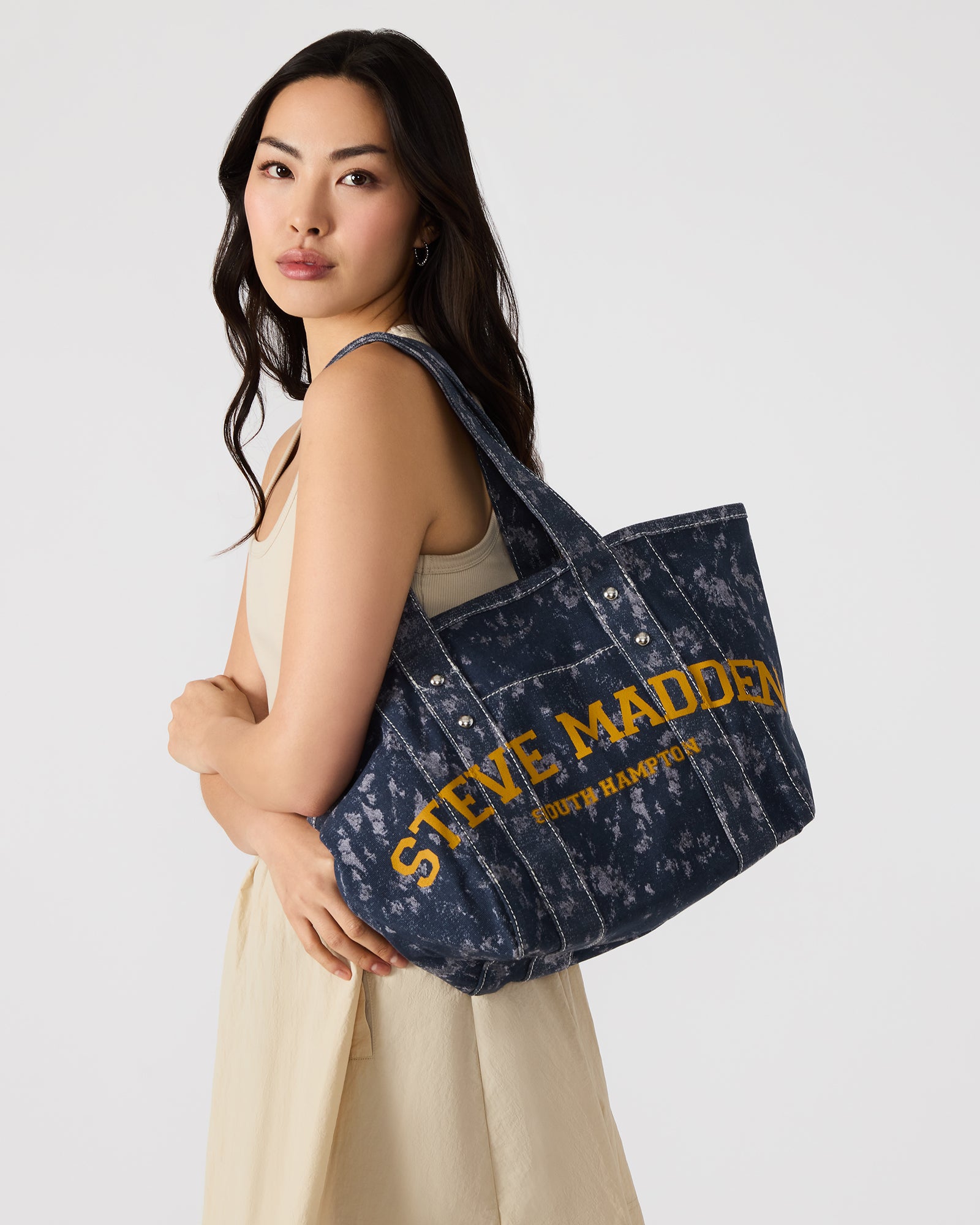 Interior view of the denim bag showing pockets and spacious compartment