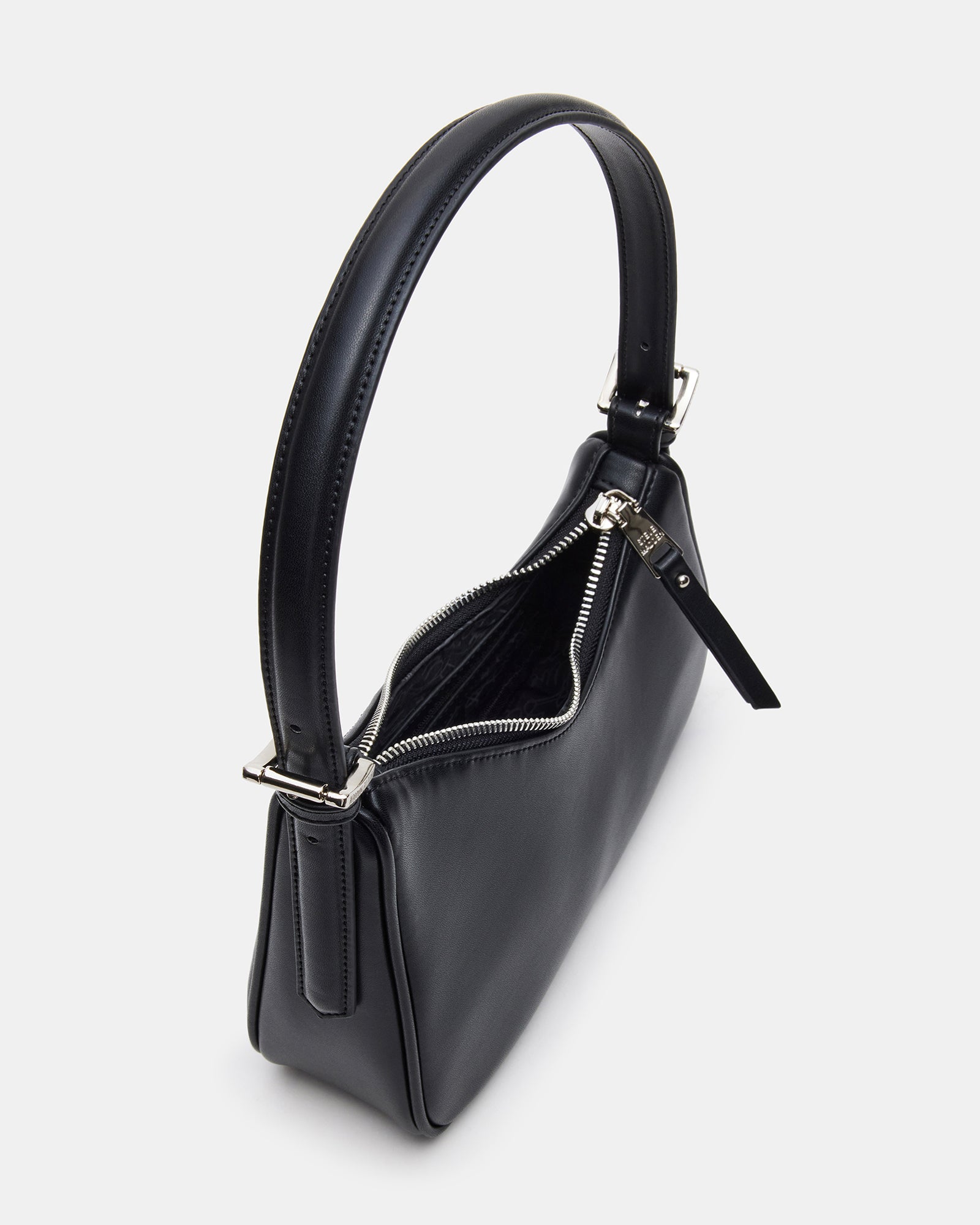 Interior of the black shoulder bag showing the zipper pocket and organization space