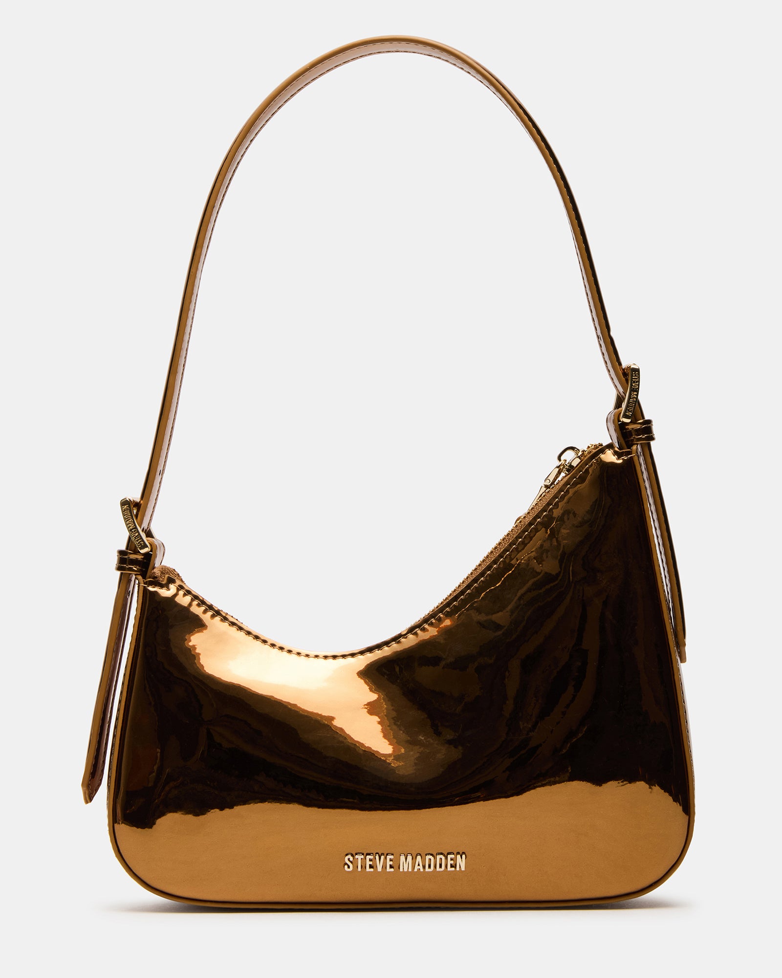 The Bronze Asymmetrical Shoulder Bag worn crossbody style against a city backdrop.