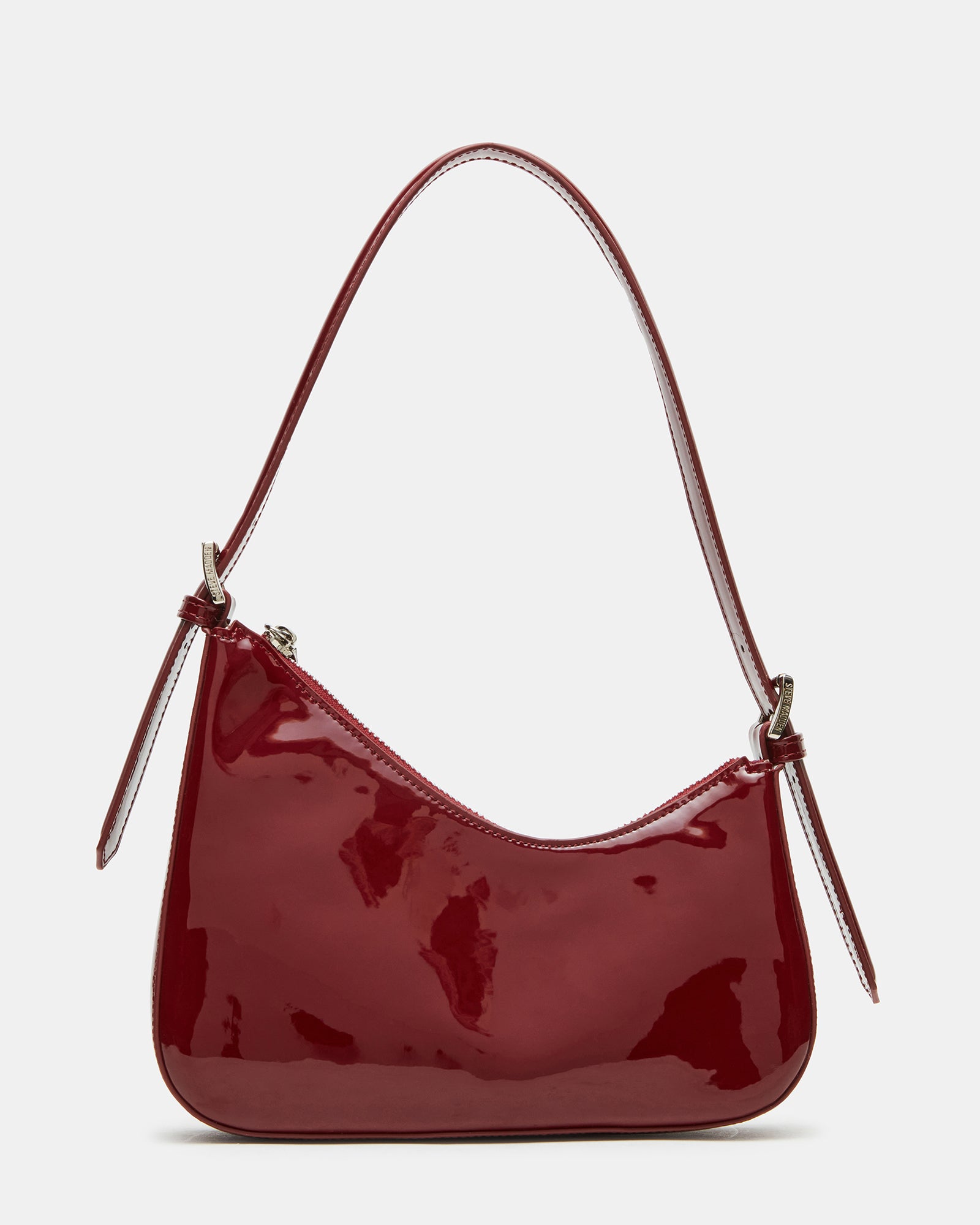 Asymmetrical shoulder bag in wine color with zip closure.