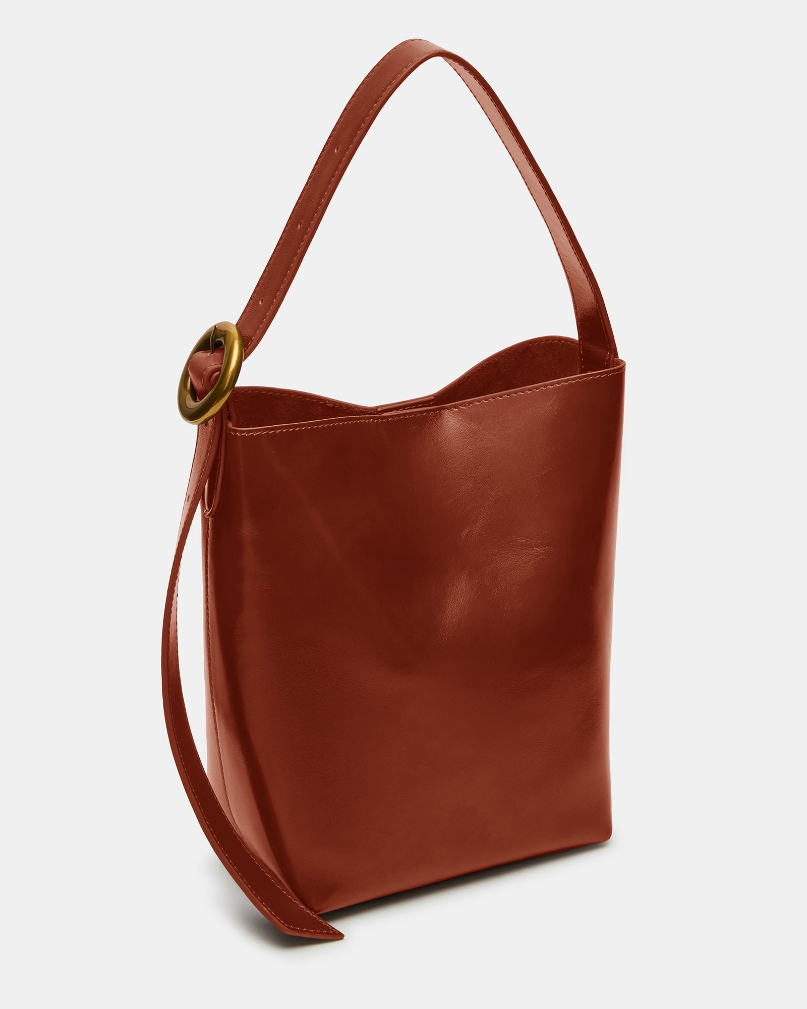 Rust leather shoulder bag with rounded hardware and magnetic snap closure, ideal for daily use