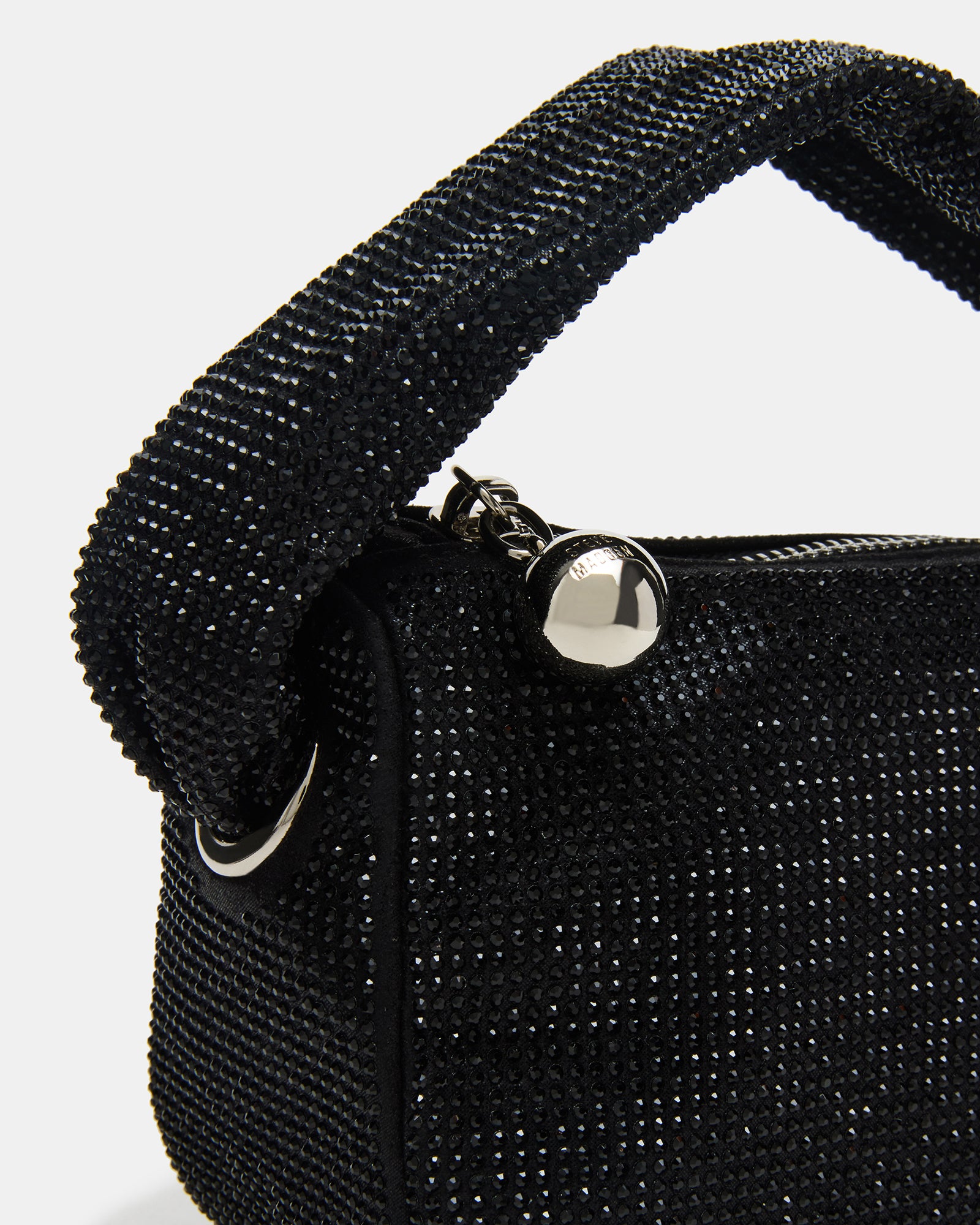 Side view showing the compact size of the black crystal bag