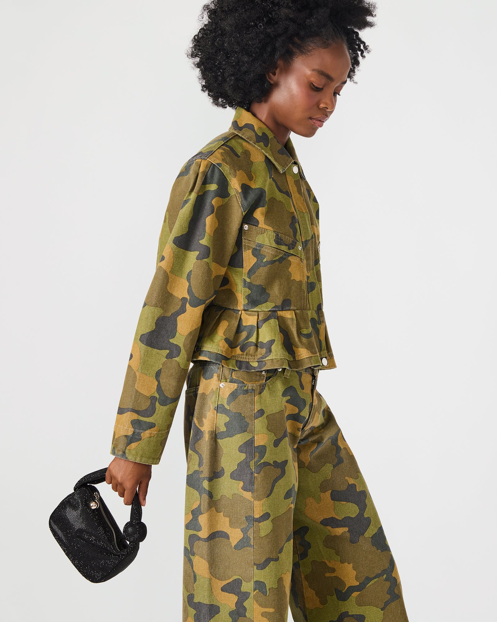 Mini top handle bag styled with evening wear for a night out