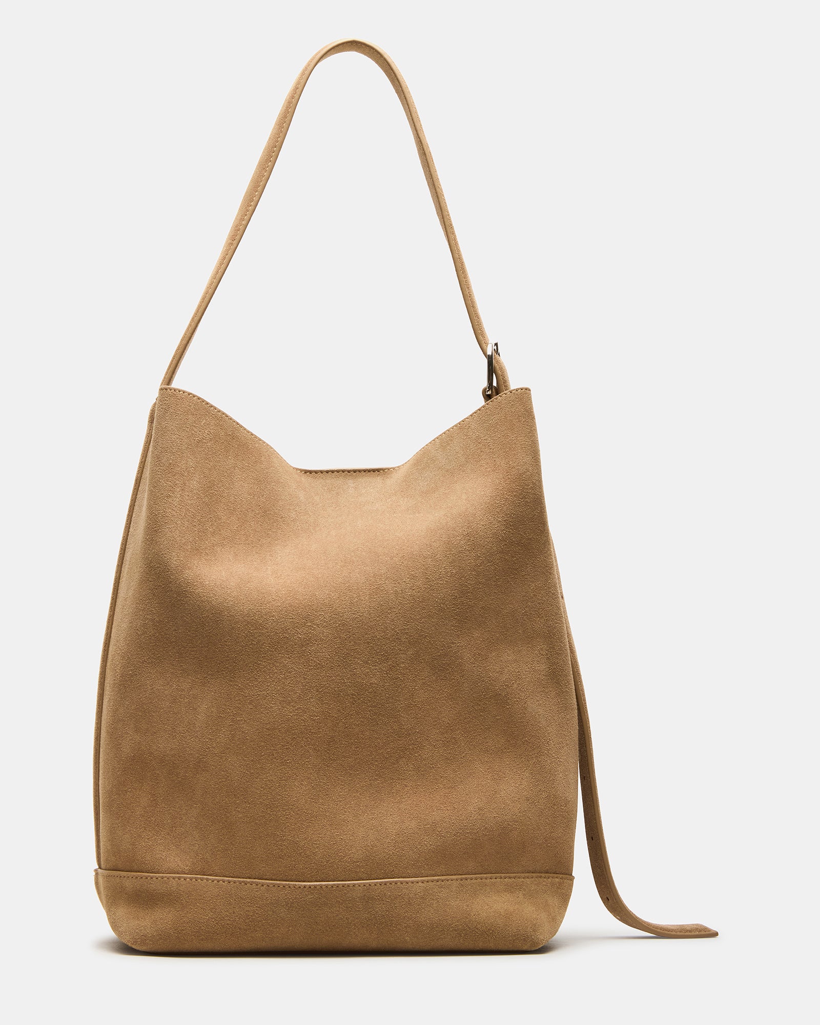 Front view of suede handbag worn crossbody outdoors in Salt Lake City