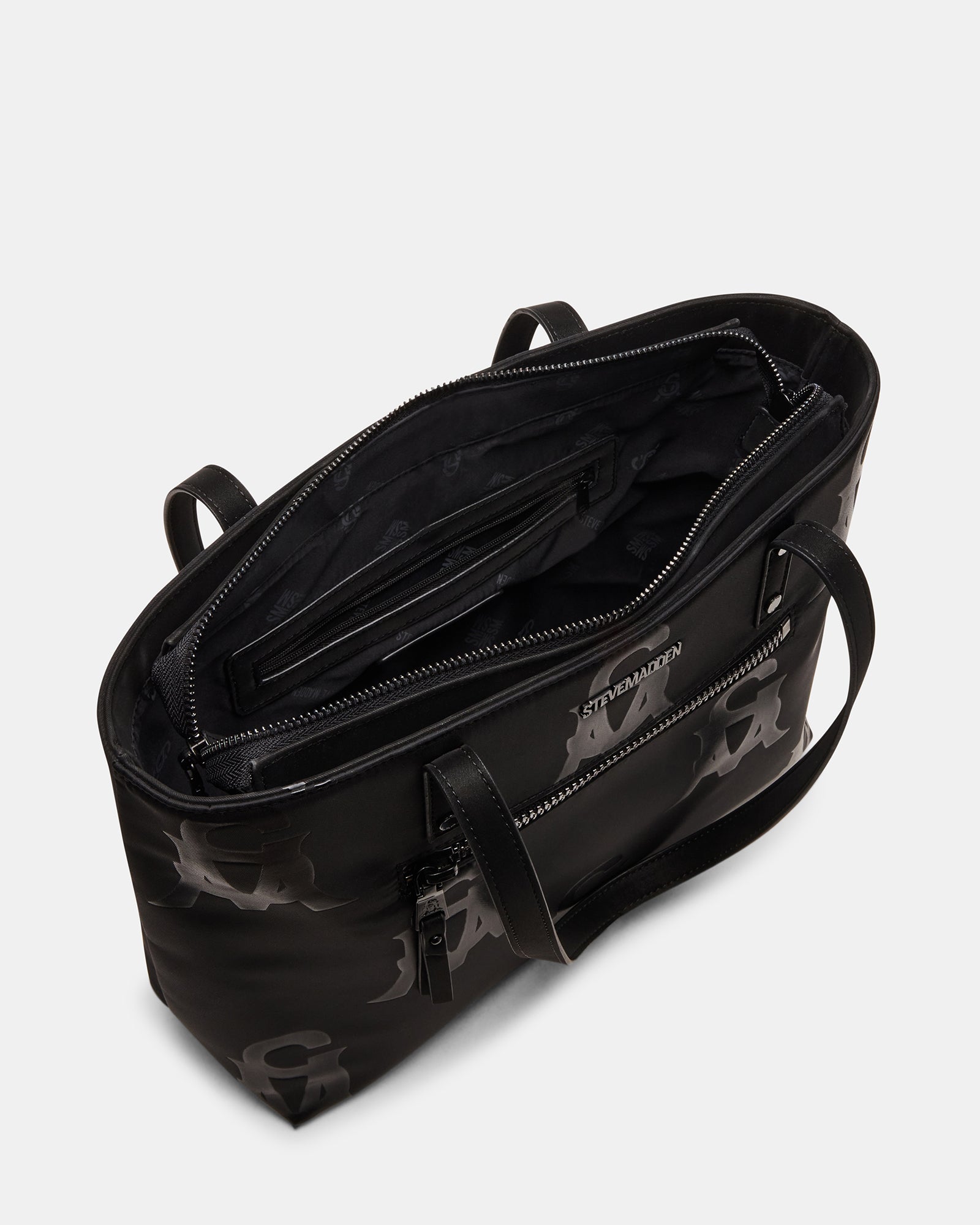 Close-up of attachable charm on fashion tote bag, highlighting accessory detail
