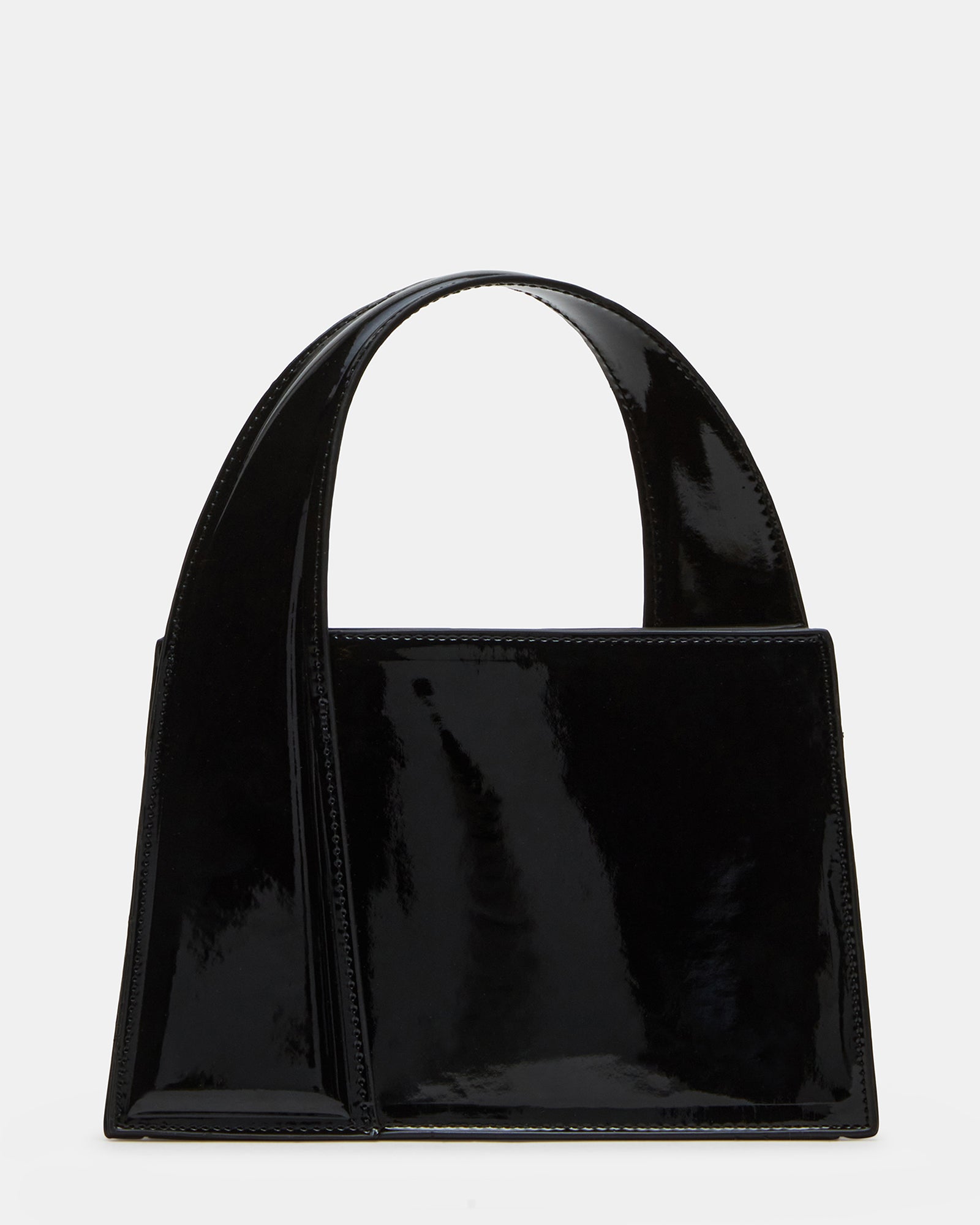 Black patent handbags styled with business wear on Boston streets