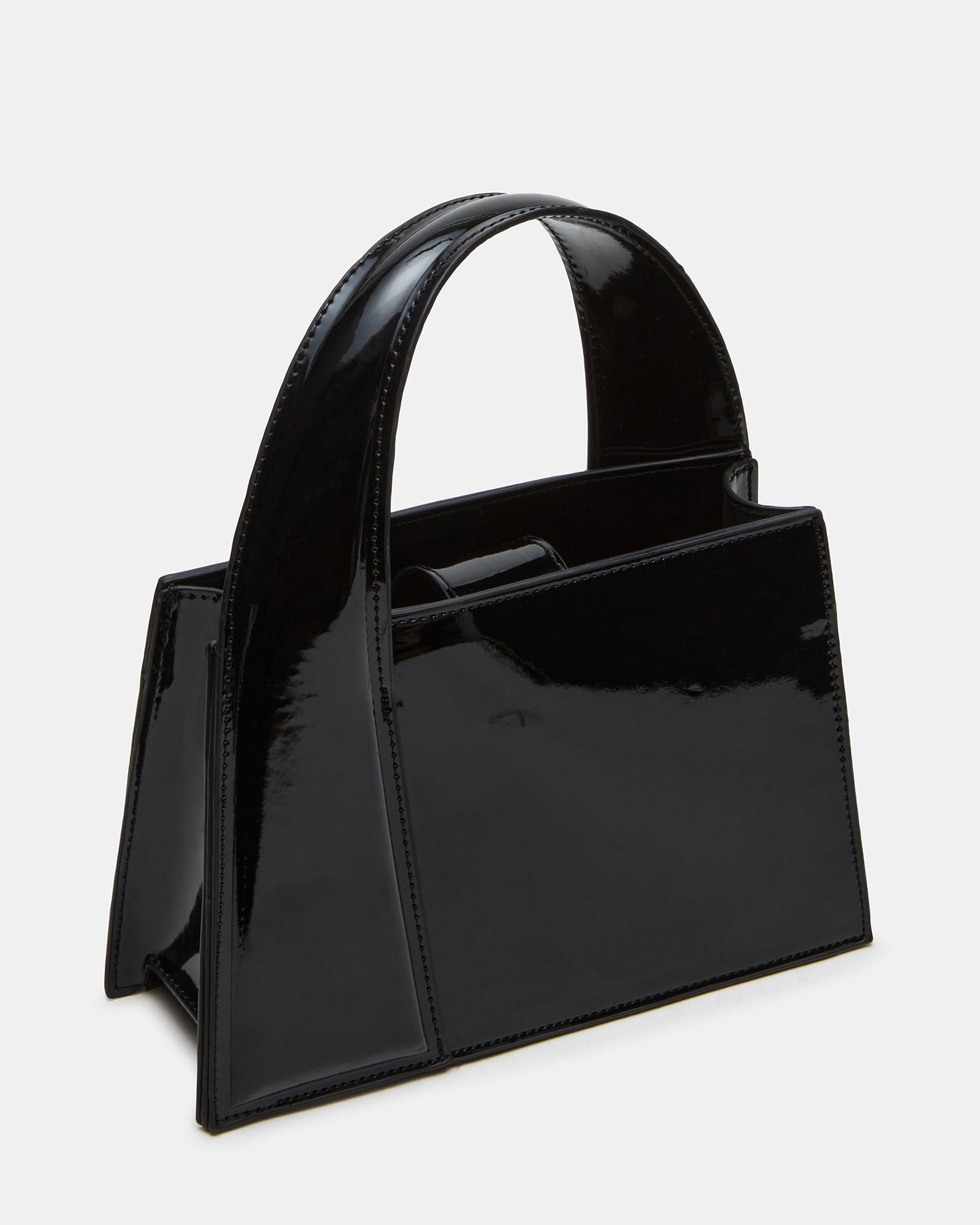 Black patent handbags styled with business wear on Boston streets
