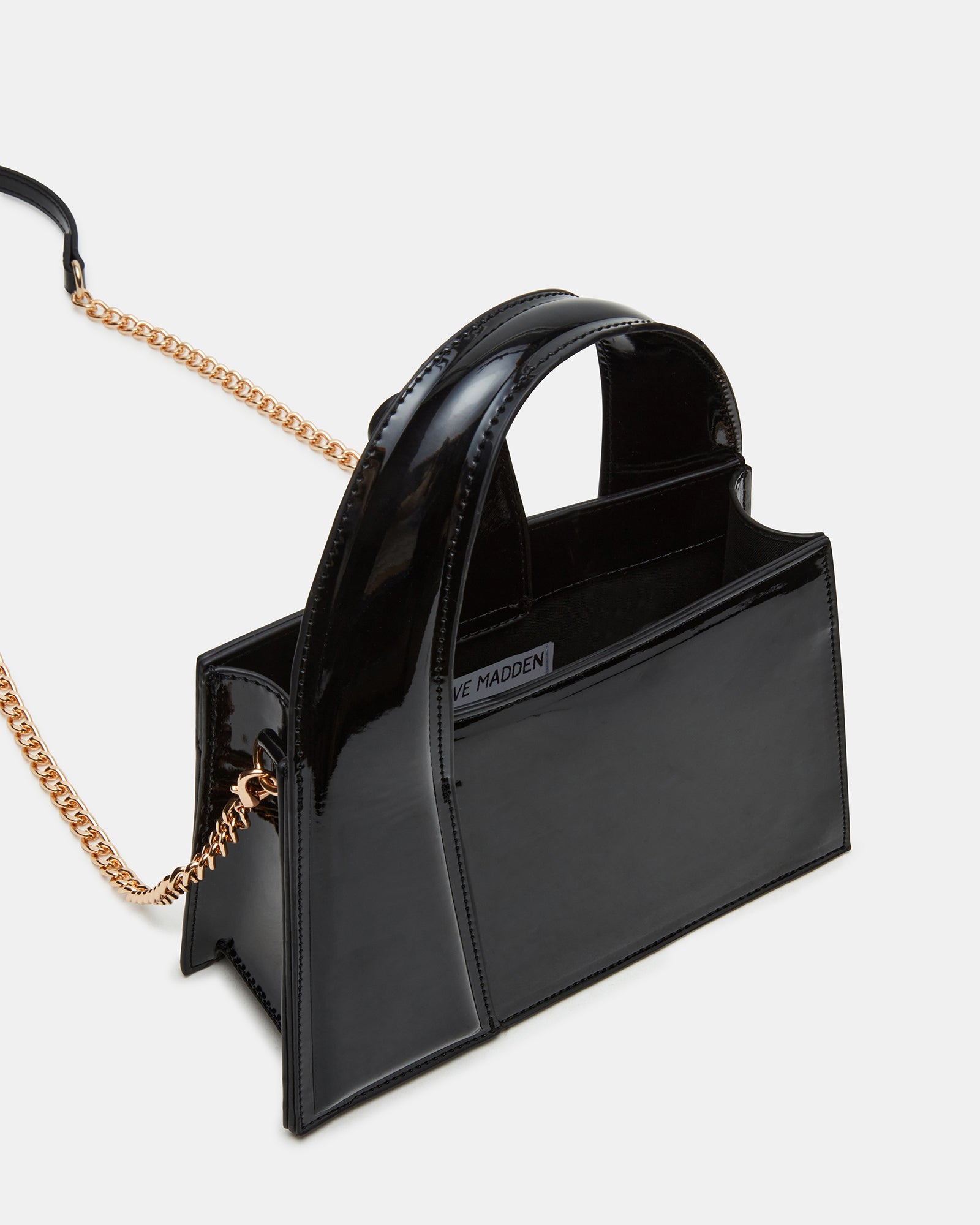 Structured trapezoid bag shown with detachable chain strap and side profile