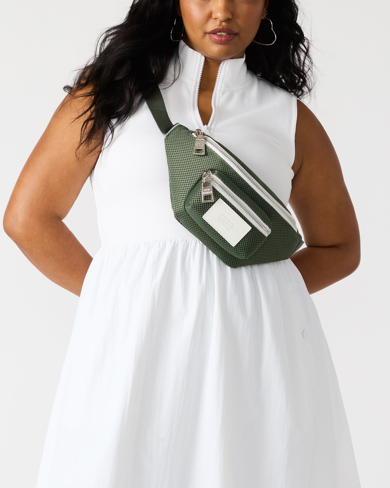Close-up of adjustable buckle strap on black crossbody bag