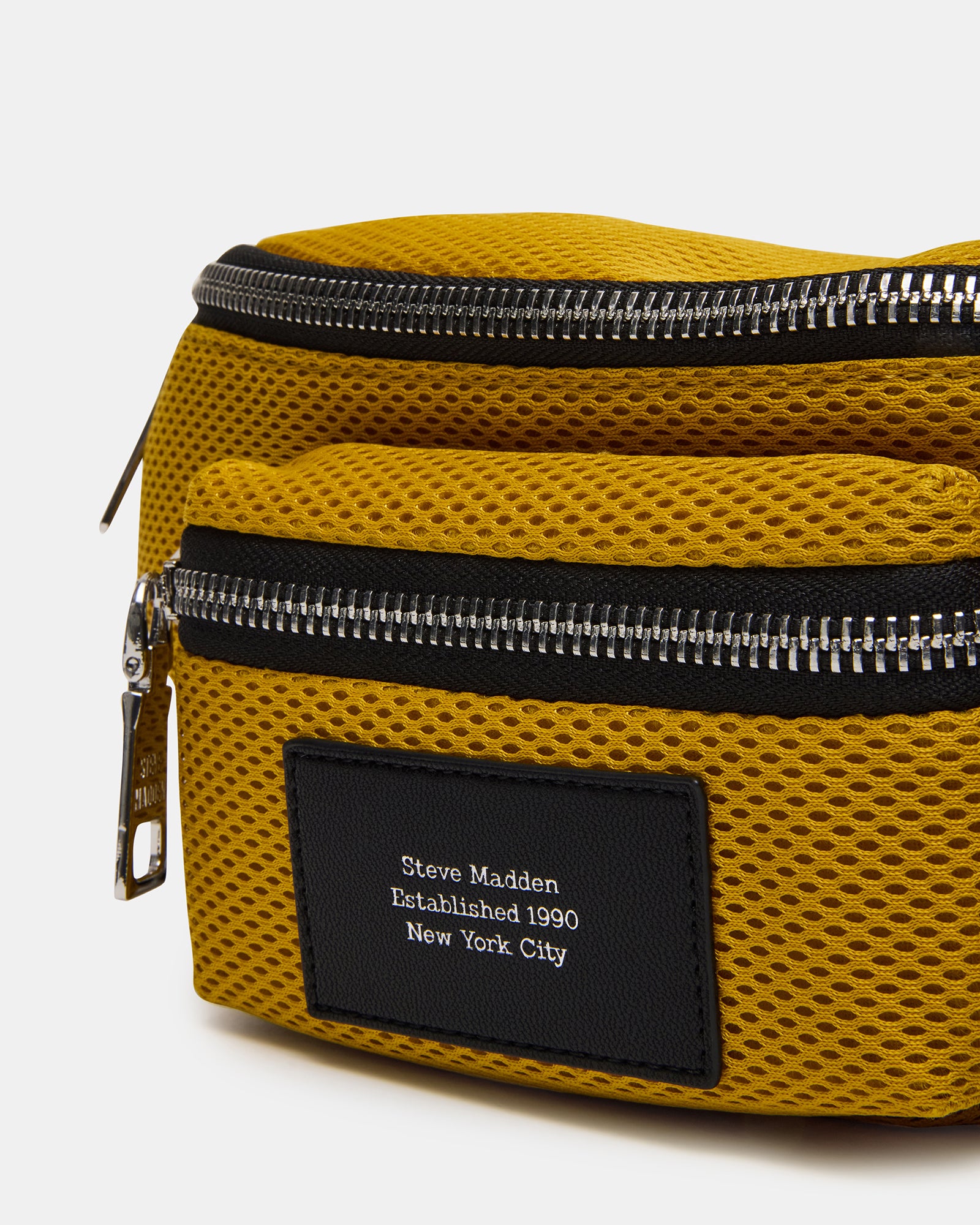 Close-up of the adjustable strap and zipper closure on the Verdict Bag